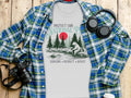 White t-shirt with bear fishing and text "PROTECT OUR NATIONAL PARKS".