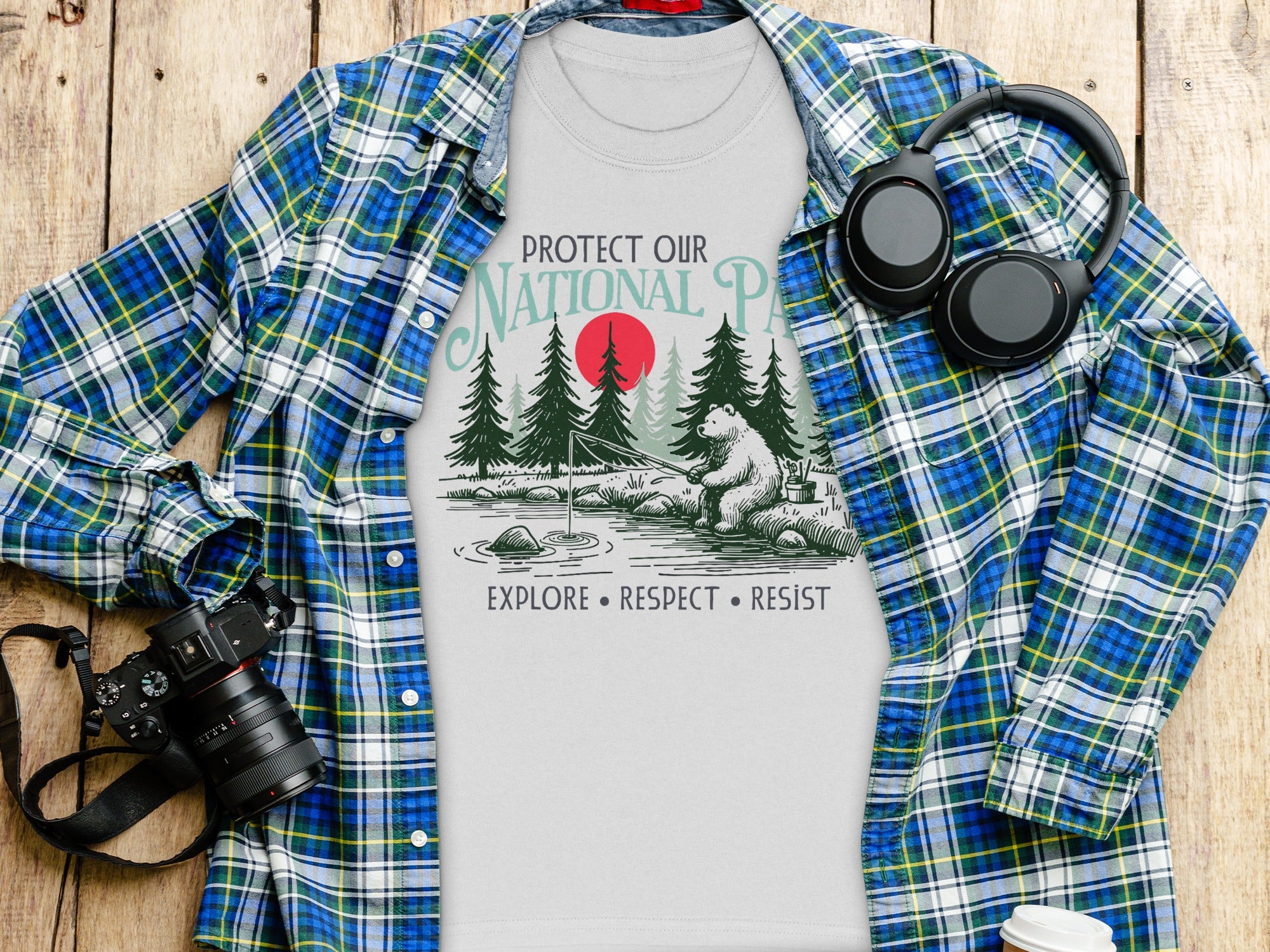 White t-shirt with bear fishing and text "PROTECT OUR NATIONAL PARKS".