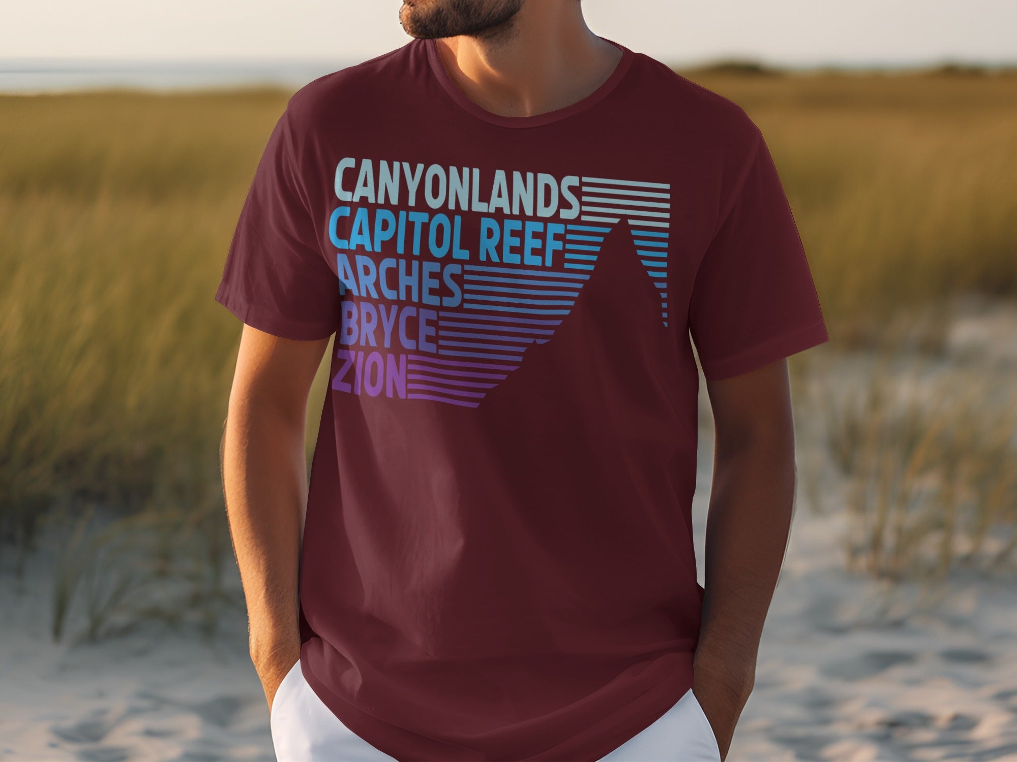 Maroon t-shirt with Canyonlands, Capitol Reef, Arches, Bryce, and Zion text.