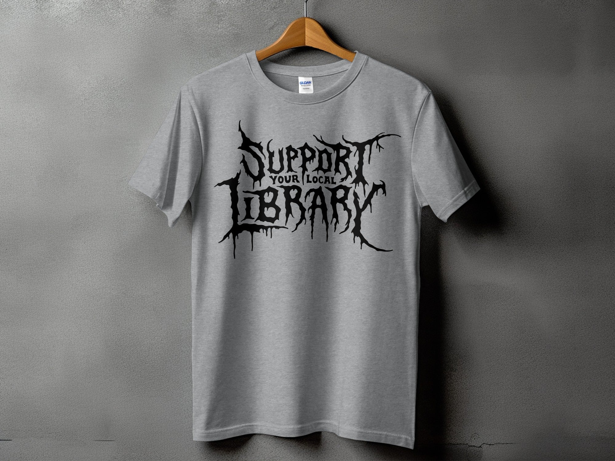 Gray t-shirt with black "Support Your Local Library" text in gothic font.