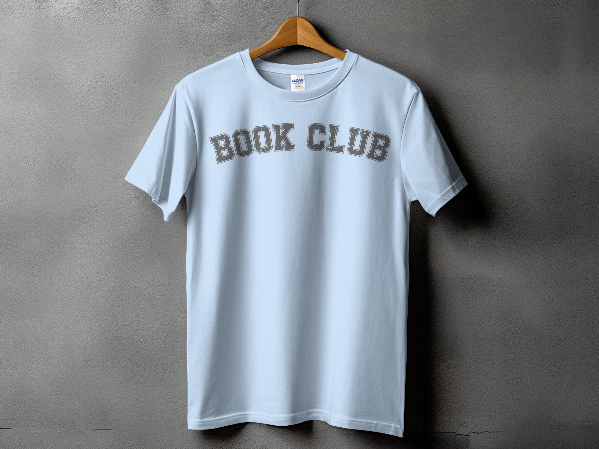 Light blue t-shirt with "BOOK CLUB" in distressed gray collegiate lettering.