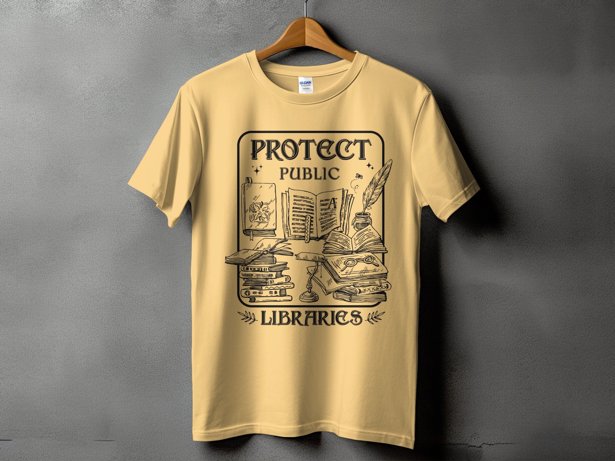 Yellow t-shirt with black graphic of books, inkwell, and "Protect Public Libraries" text.