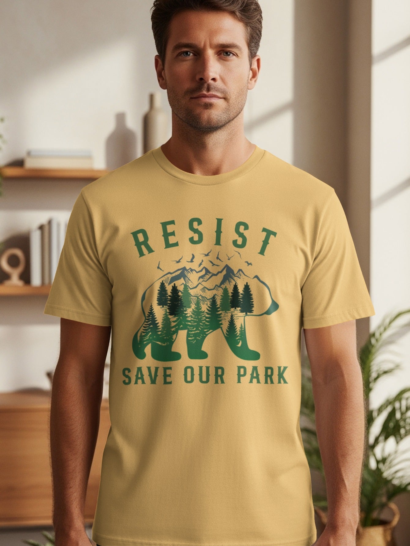 Yellow t-shirt with "RESIST SAVE OUR PARK" text and a bear silhouette filled with trees and mountains.