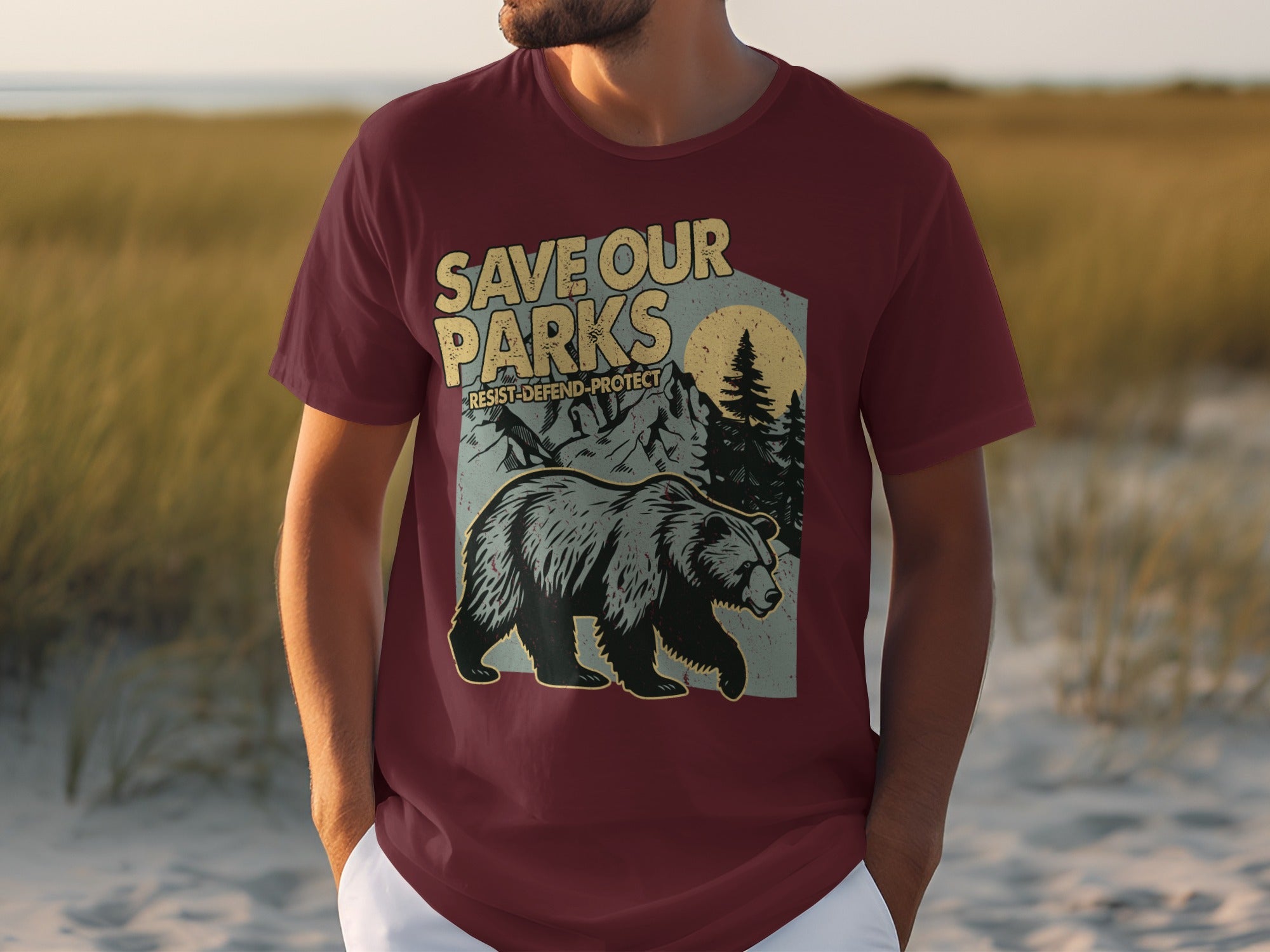 Maroon t-shirt with graphic of bear, mountains, trees, and "Save Our Parks".