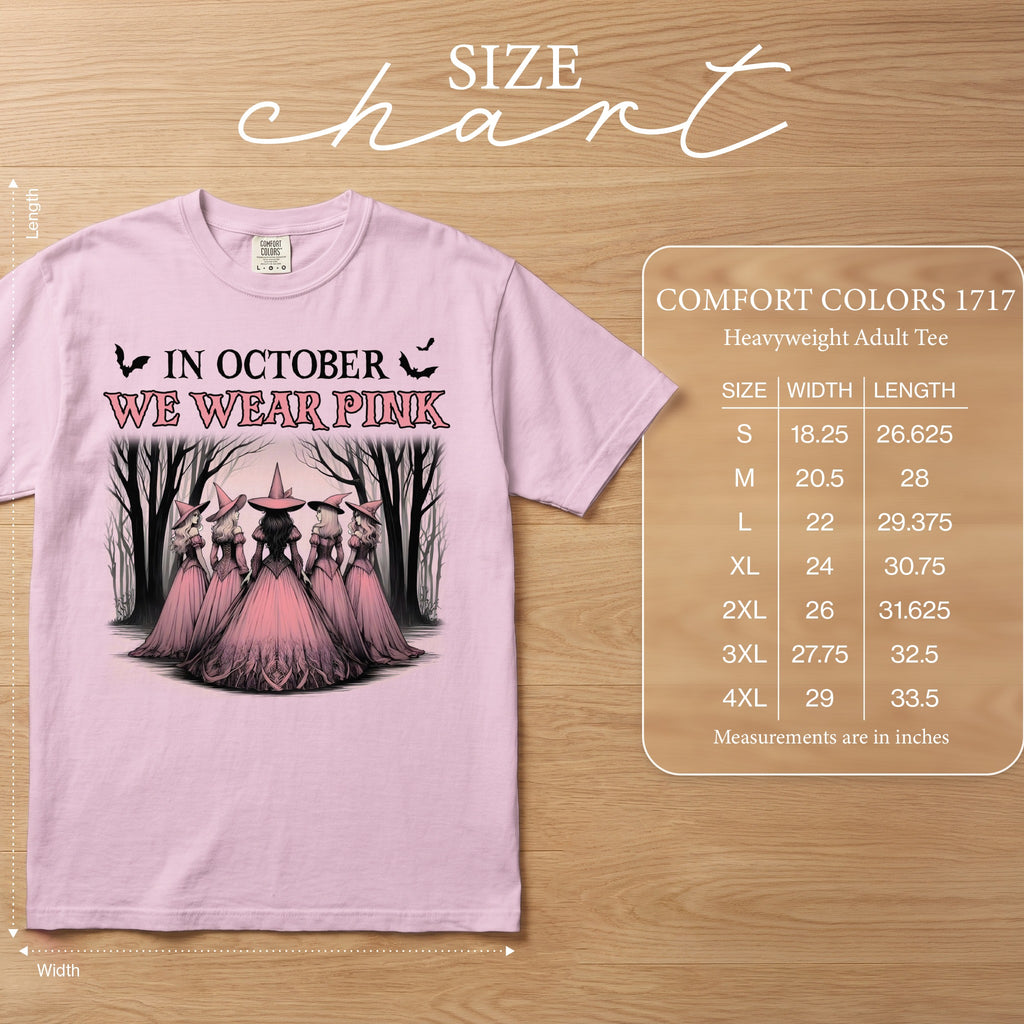 Pink t-shirt with "In October We Wear Pink" and witch graphic. Size chart included.