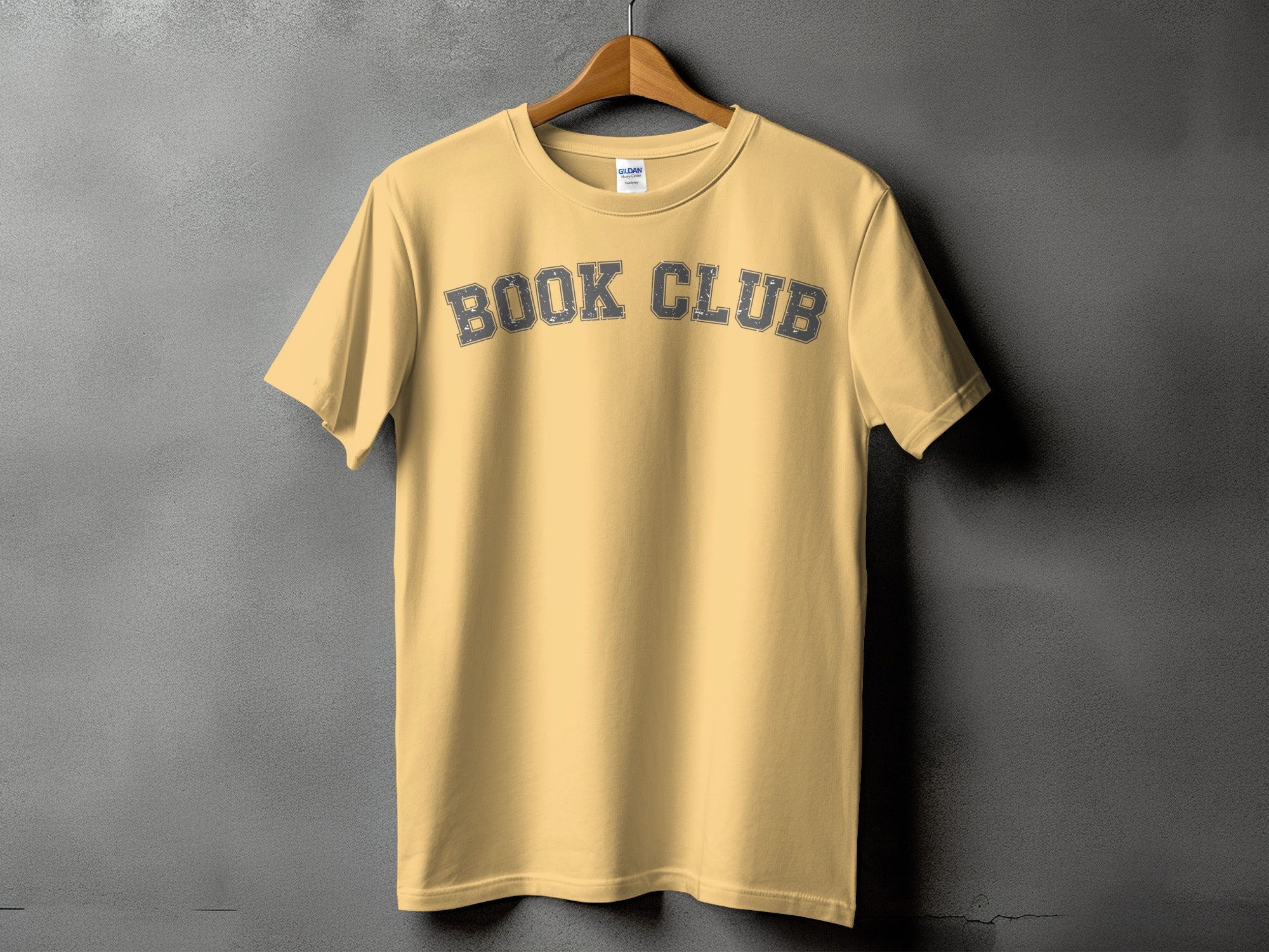 Light yellow t-shirt with "BOOK CLUB" text printed on the front.