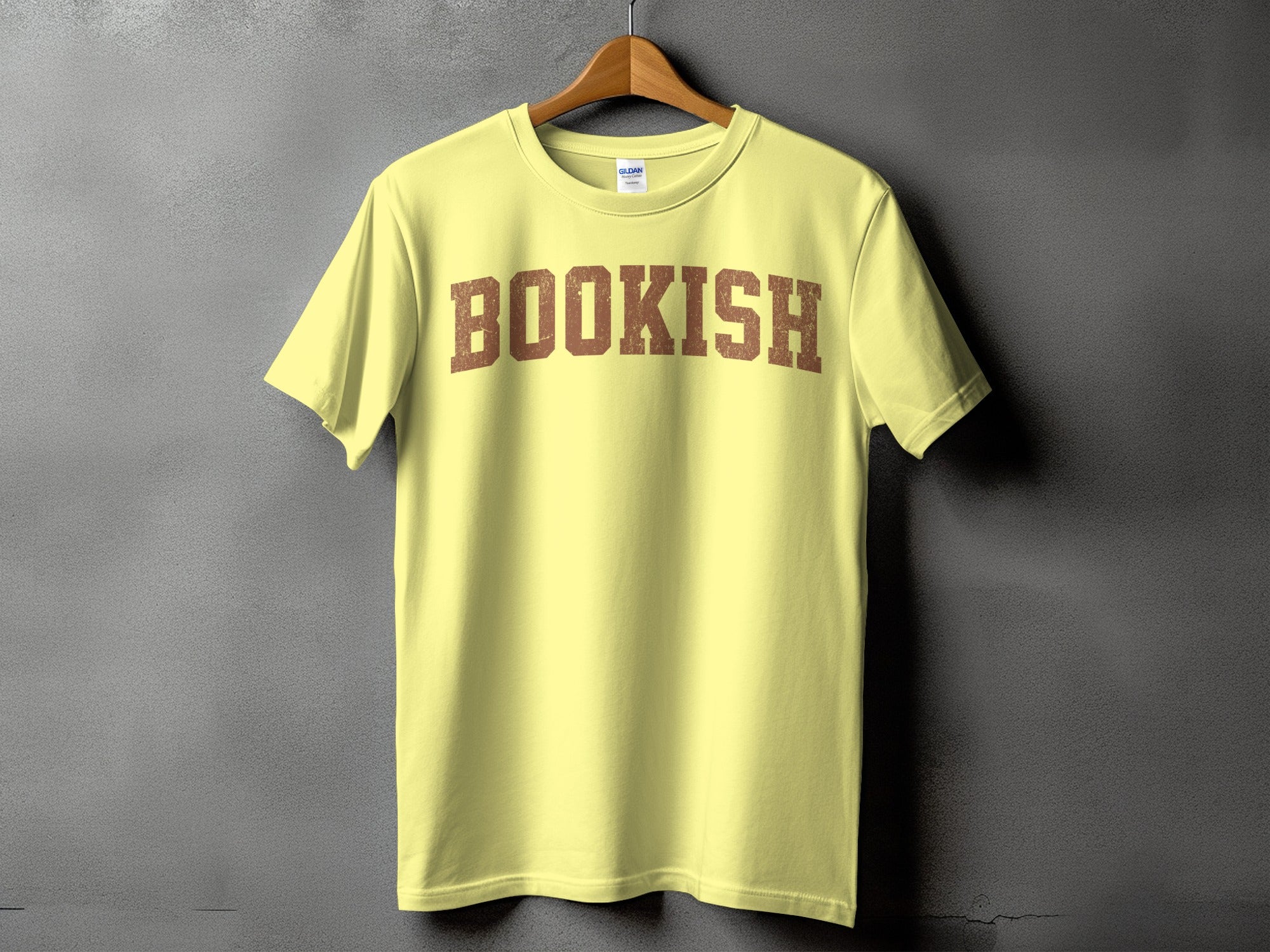 Yellow t-shirt with distressed brown "BOOKISH" text across the chest.
