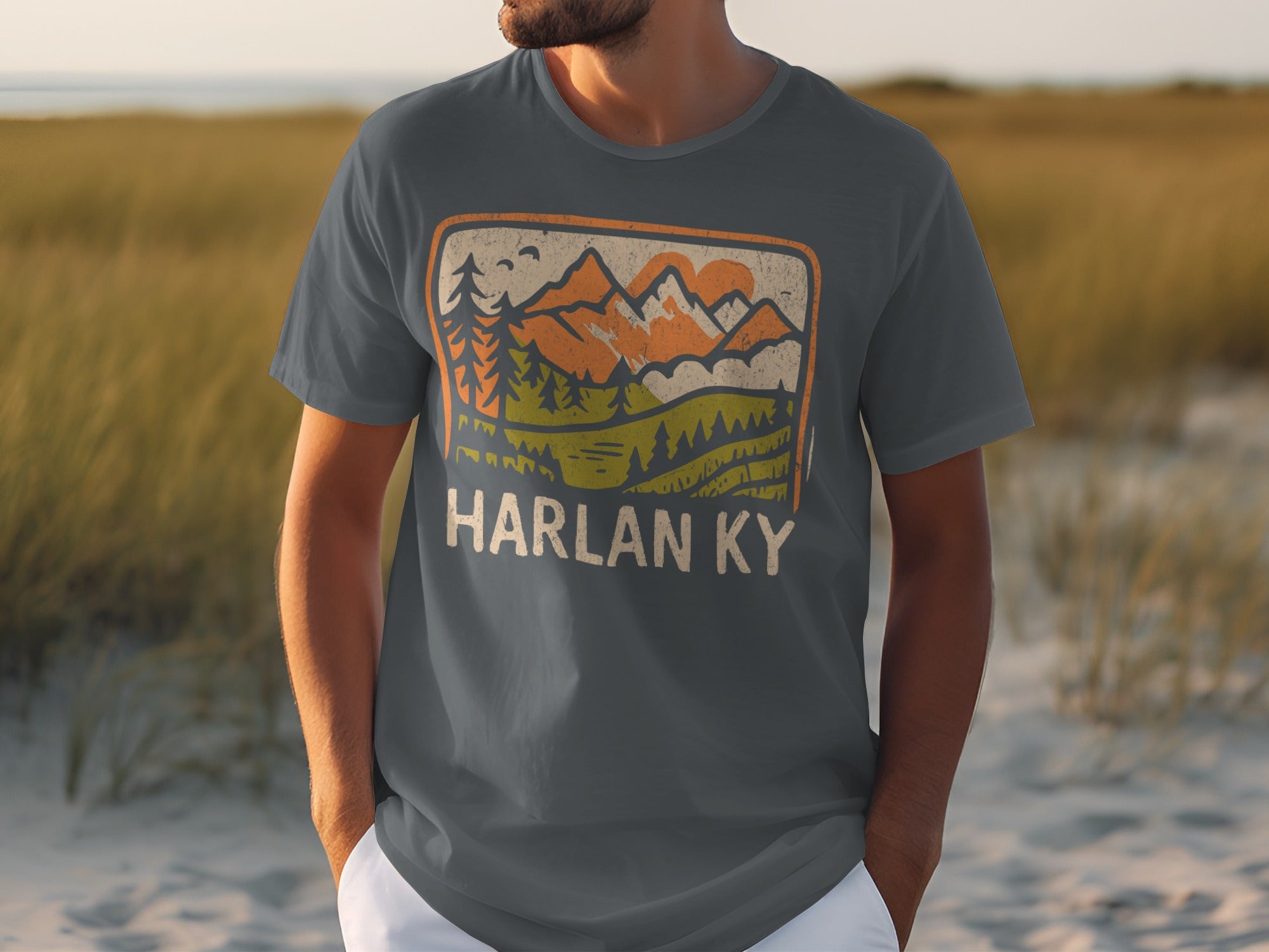 Gray t-shirt with vintage mountain landscape graphic and "HARLAN KY" text.