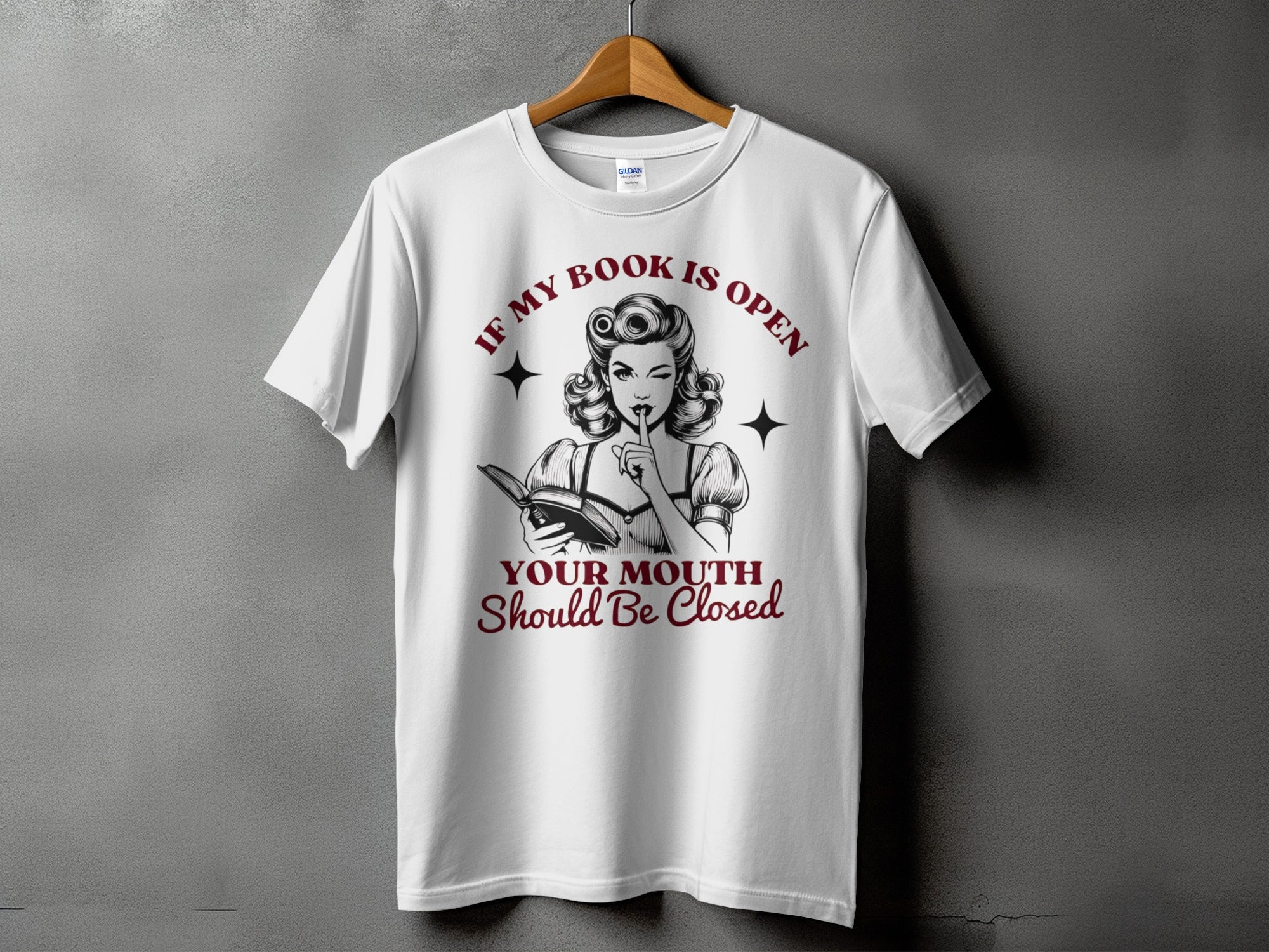 White t-shirt with "If my book is open, your mouth should be closed" text