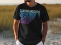 Black t-shirt with gradient text listing Canyonlands, Capitol Reef, Arches, Bryce, and Zion.