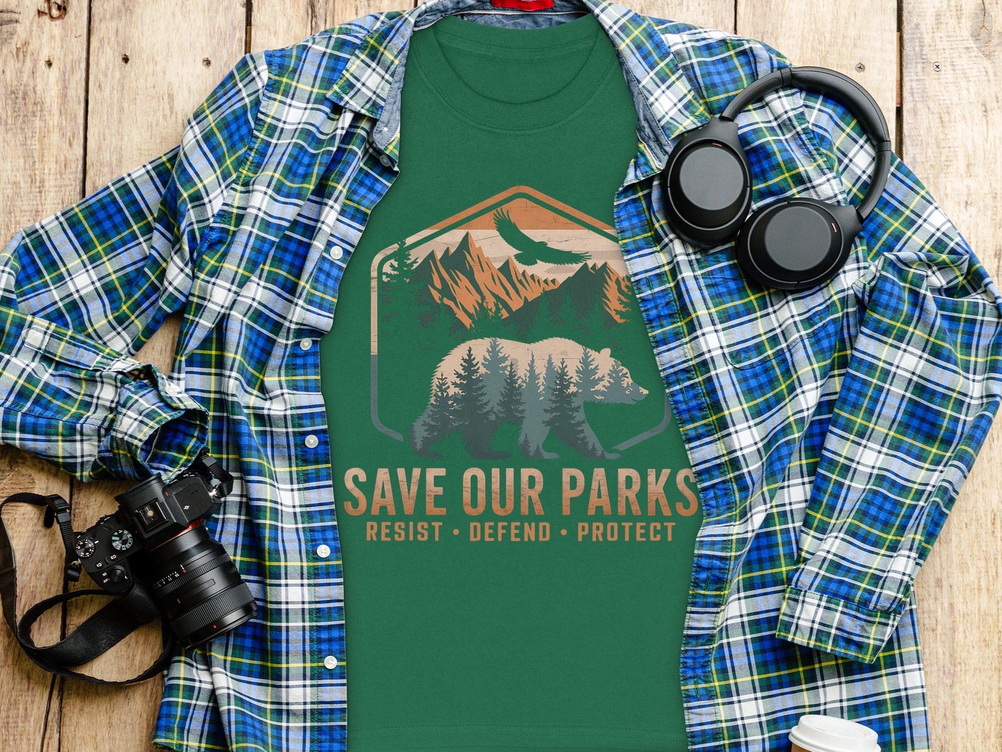 Green t-shirt with a bear, mountains, and eagle design with "SAVE OUR PARKS" text.