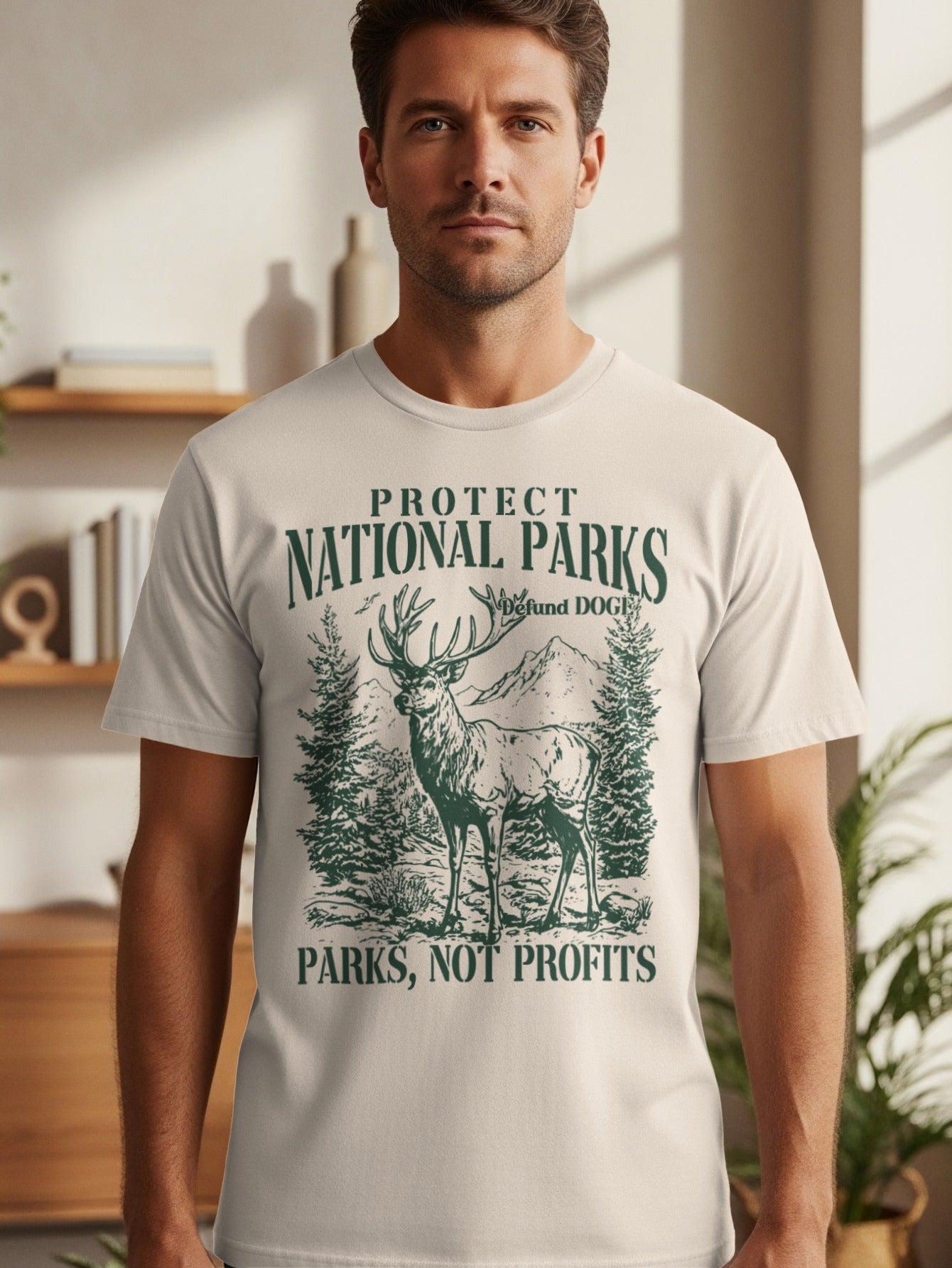 T-shirt with "Protect National Parks" text, deer, trees, and mountains design.