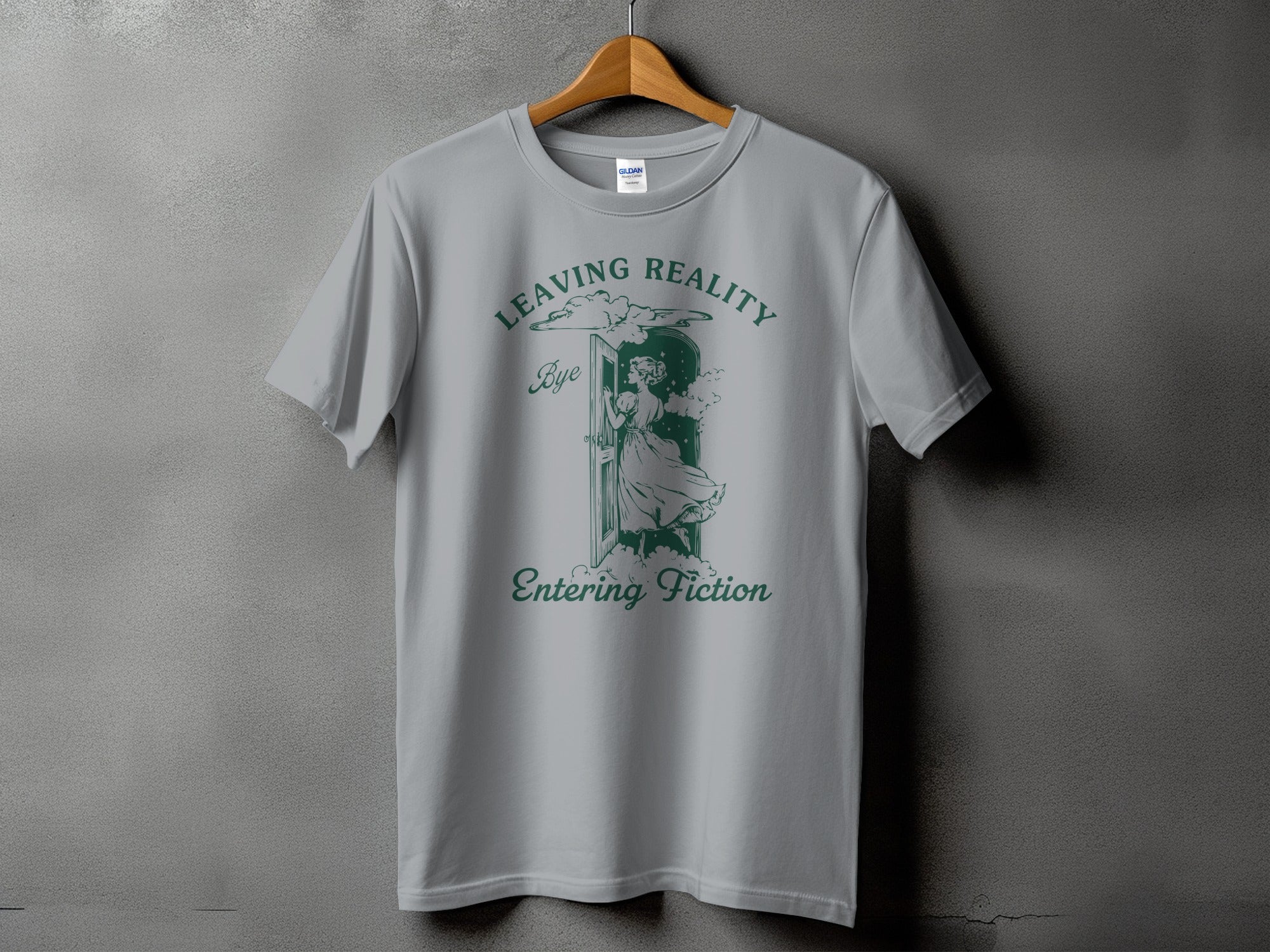 Grey t-shirt with green text "Leaving Reality" and "Entering Fiction" and an illustration.