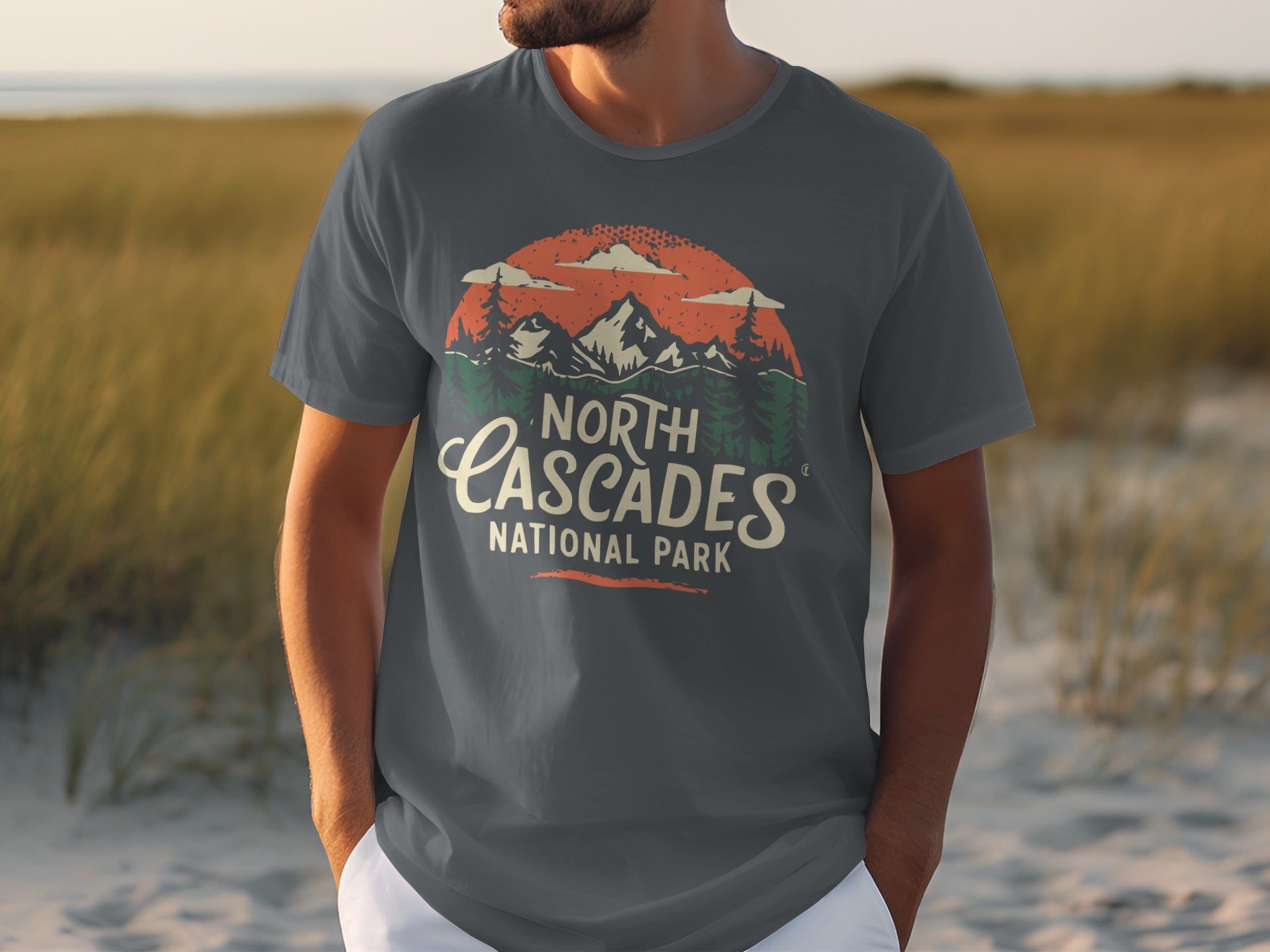 Dark grey t-shirt with North Cascades National Park graphic featuring mountains and trees.