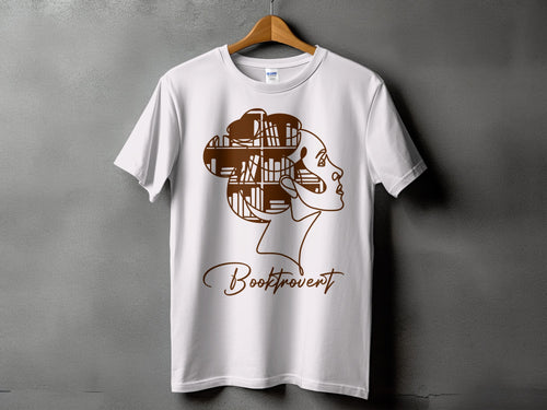 White t-shirt with brown line art of a woman's face with bookshelves in hair and "Booktrovert" text.