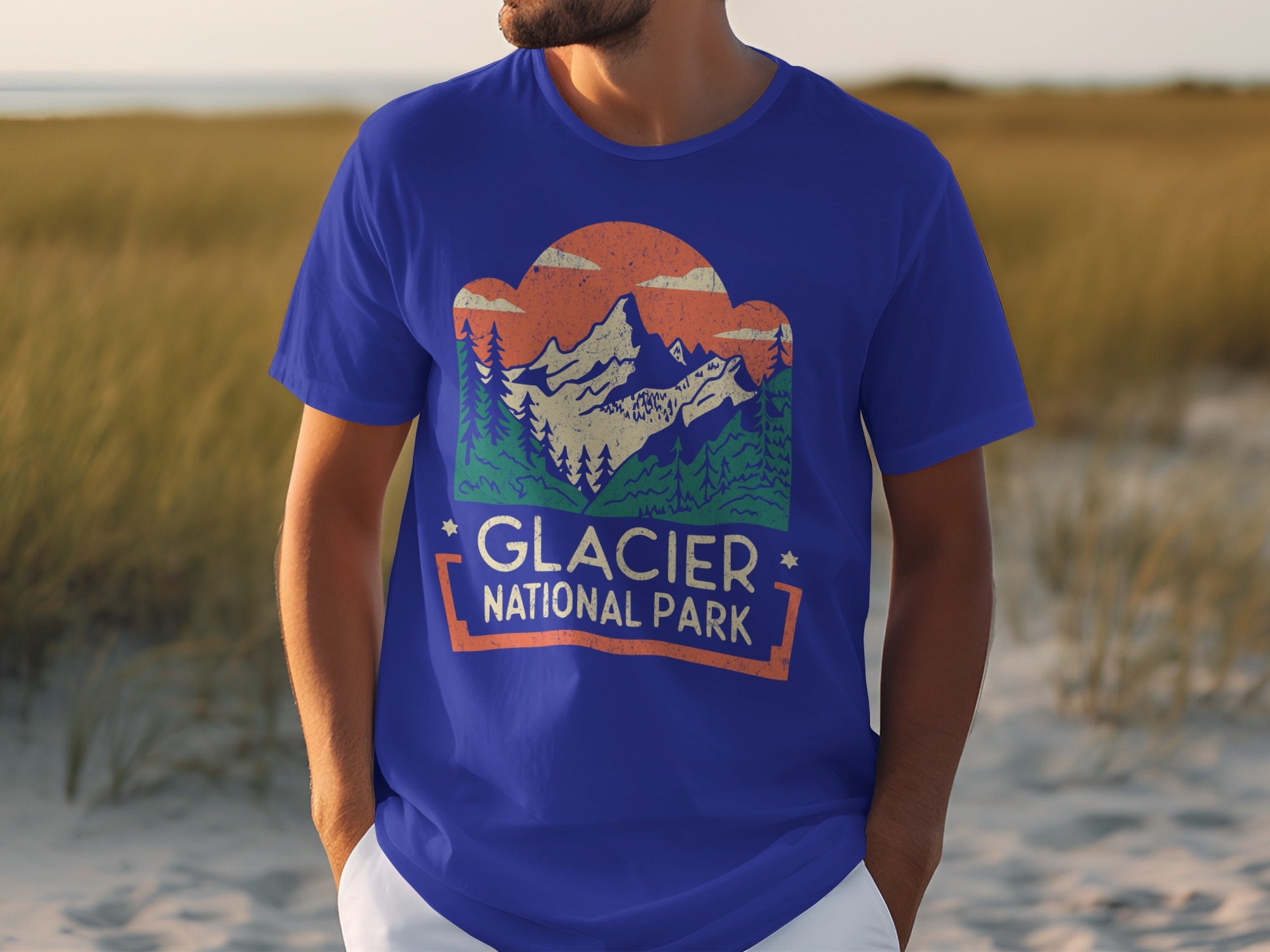 Blue t-shirt with "Glacier National Park" graphic and mountain sunset scene.