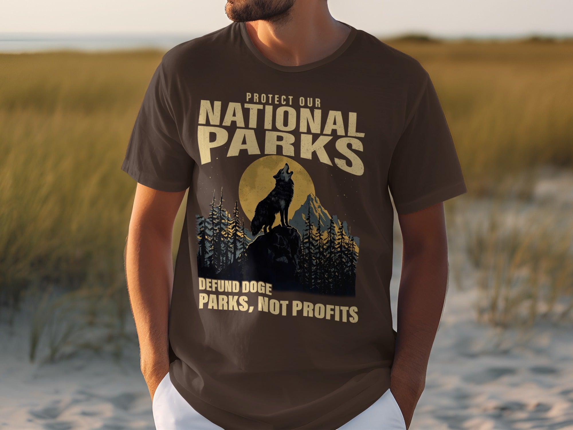 Brown t-shirt with a wolf howling at the moon at a national park.