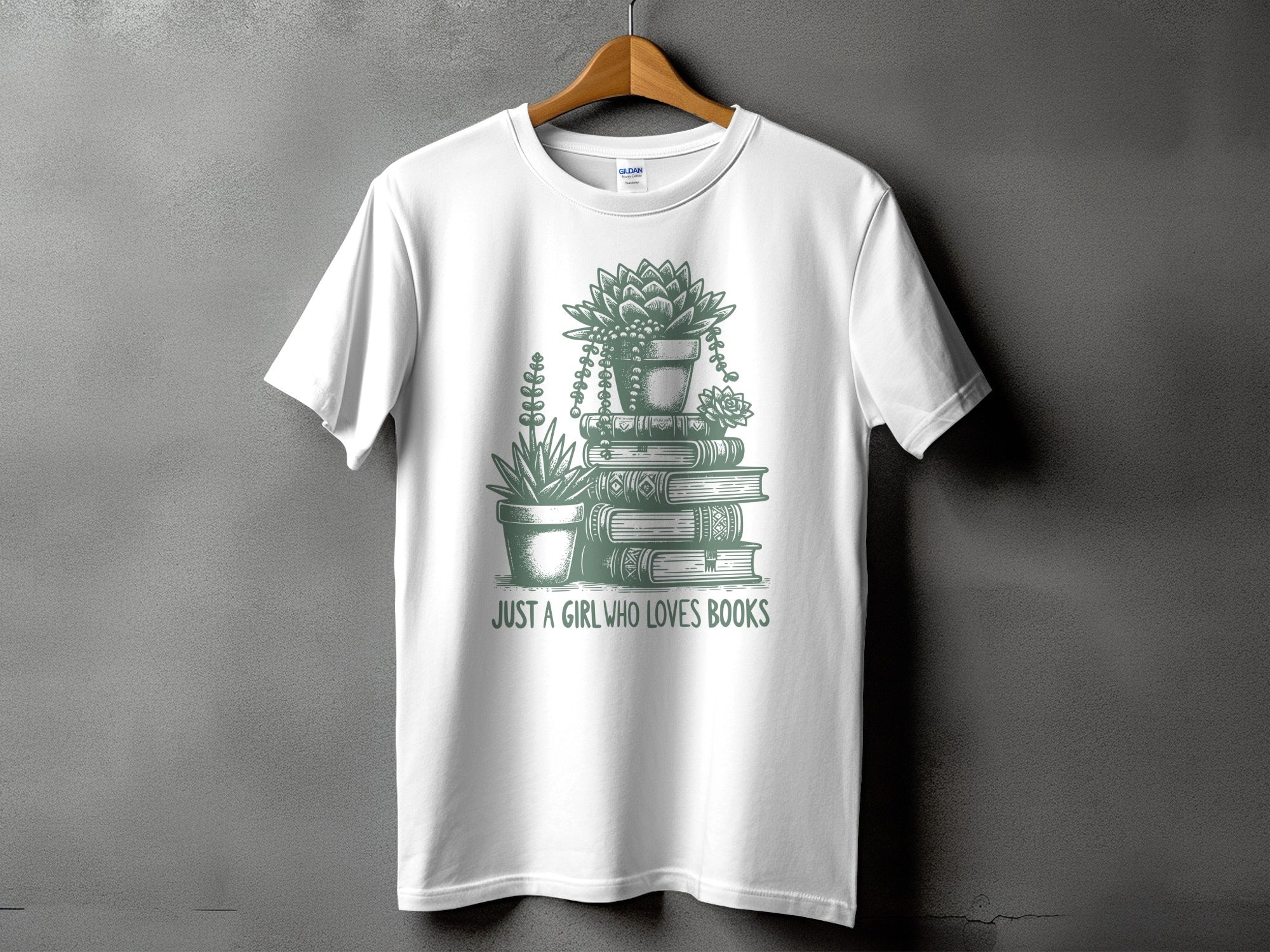 White t-shirt with graphic of potted succulents and stacked books, text reads "JUST A GIRL WHO LOVES BOOKS".