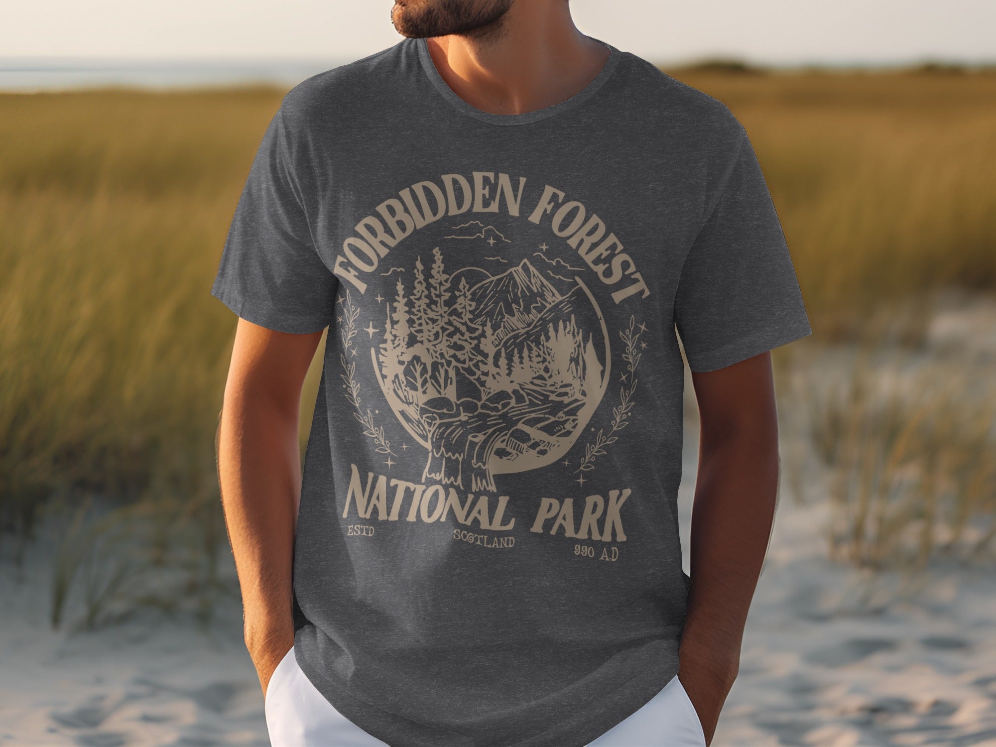 Dark grey t-shirt with "Forbidden Forest National Park Scotland 990 AD" graphic.