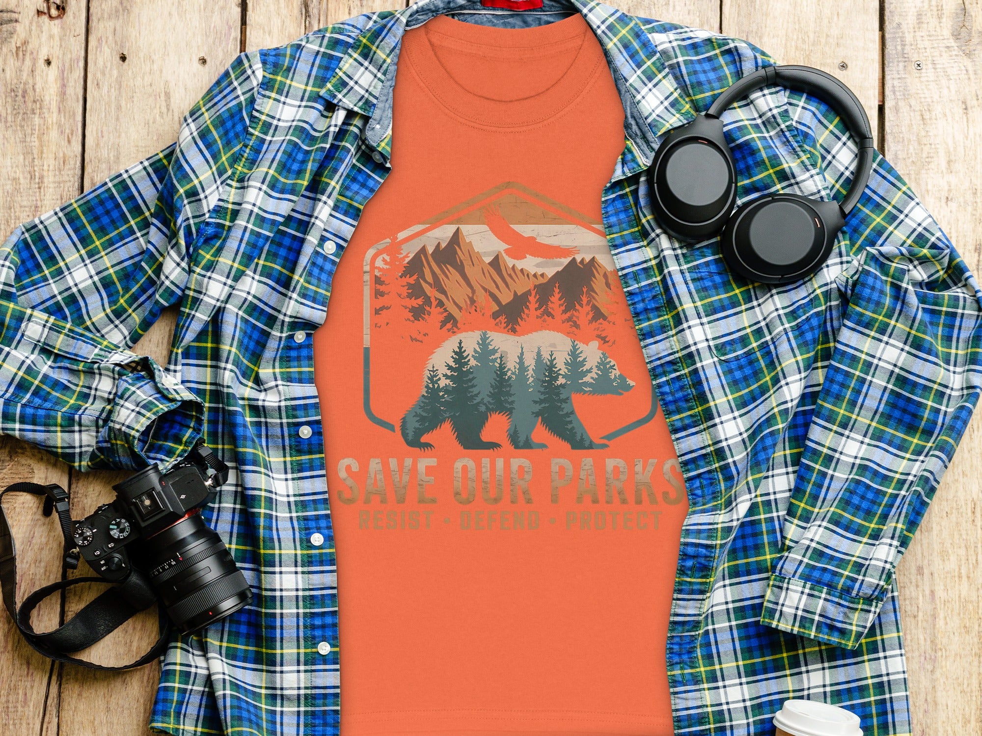 Orange t-shirt with bear mountain graphic: "SAVE OUR PARKS. RESIST - DEFEND - PROTECT."