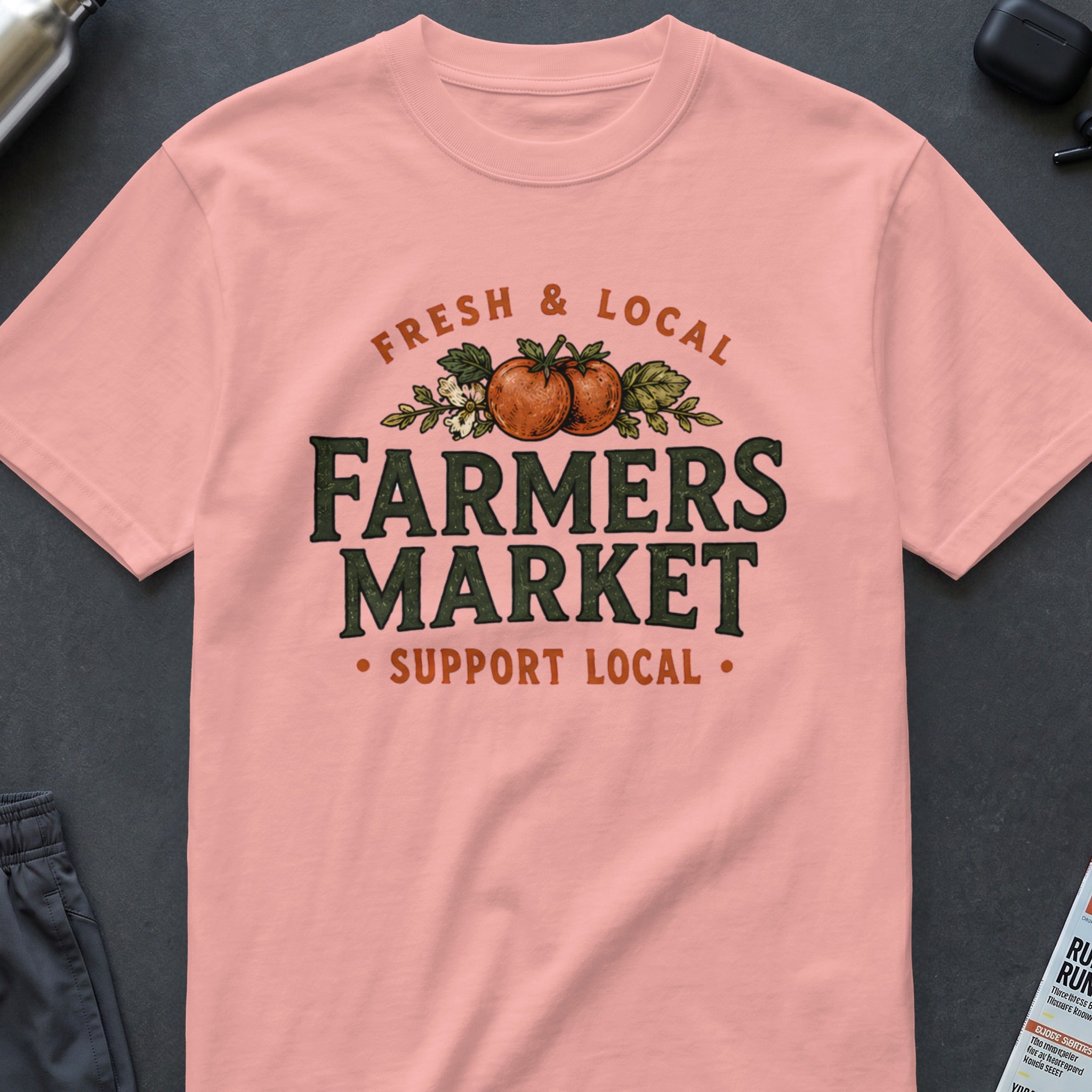 Peach t-shirt with "Fresh & Local Farmers Market Support Local" text and tomato illustration.