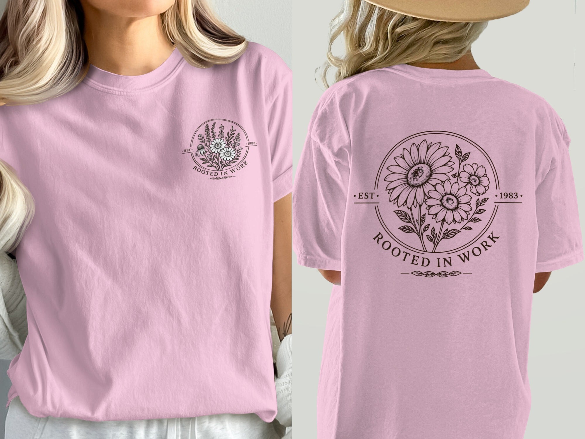Pink t-shirt with circular floral design and "Rooted in Work 1983" text.