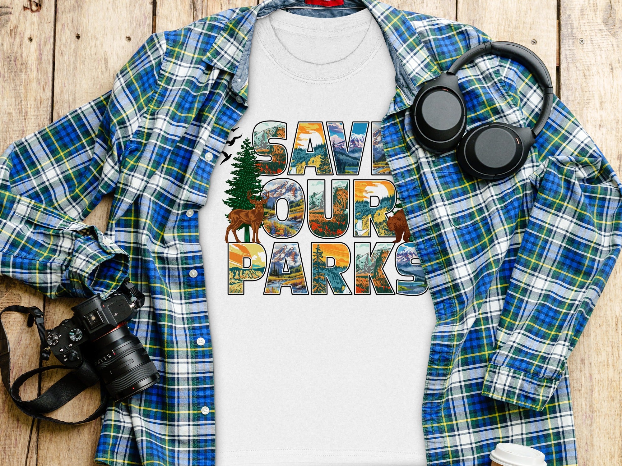 White t-shirt with "SAVE OUR PARKS" graphic featuring wildlife and landscapes.