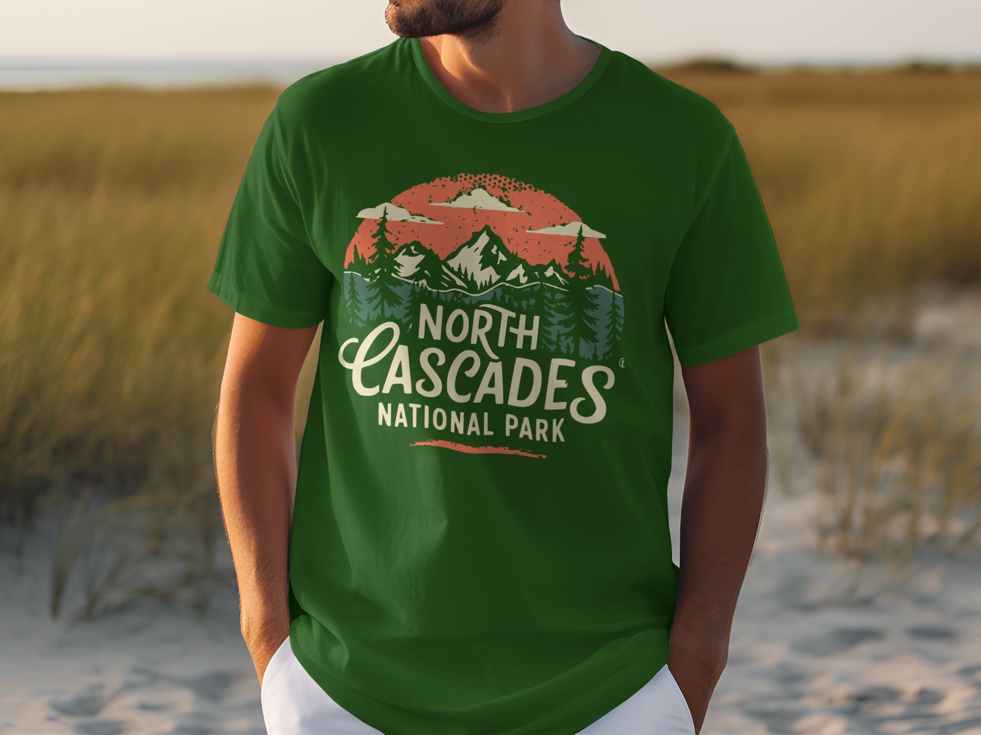 Green t-shirt featuring "North Cascades National Park" text with mountain and forest graphic.