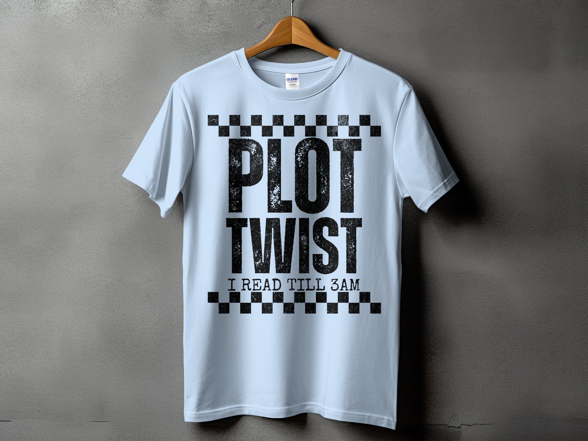 Light blue t-shirt with "PLOT TWIST I READ TILL 3AM" text.
