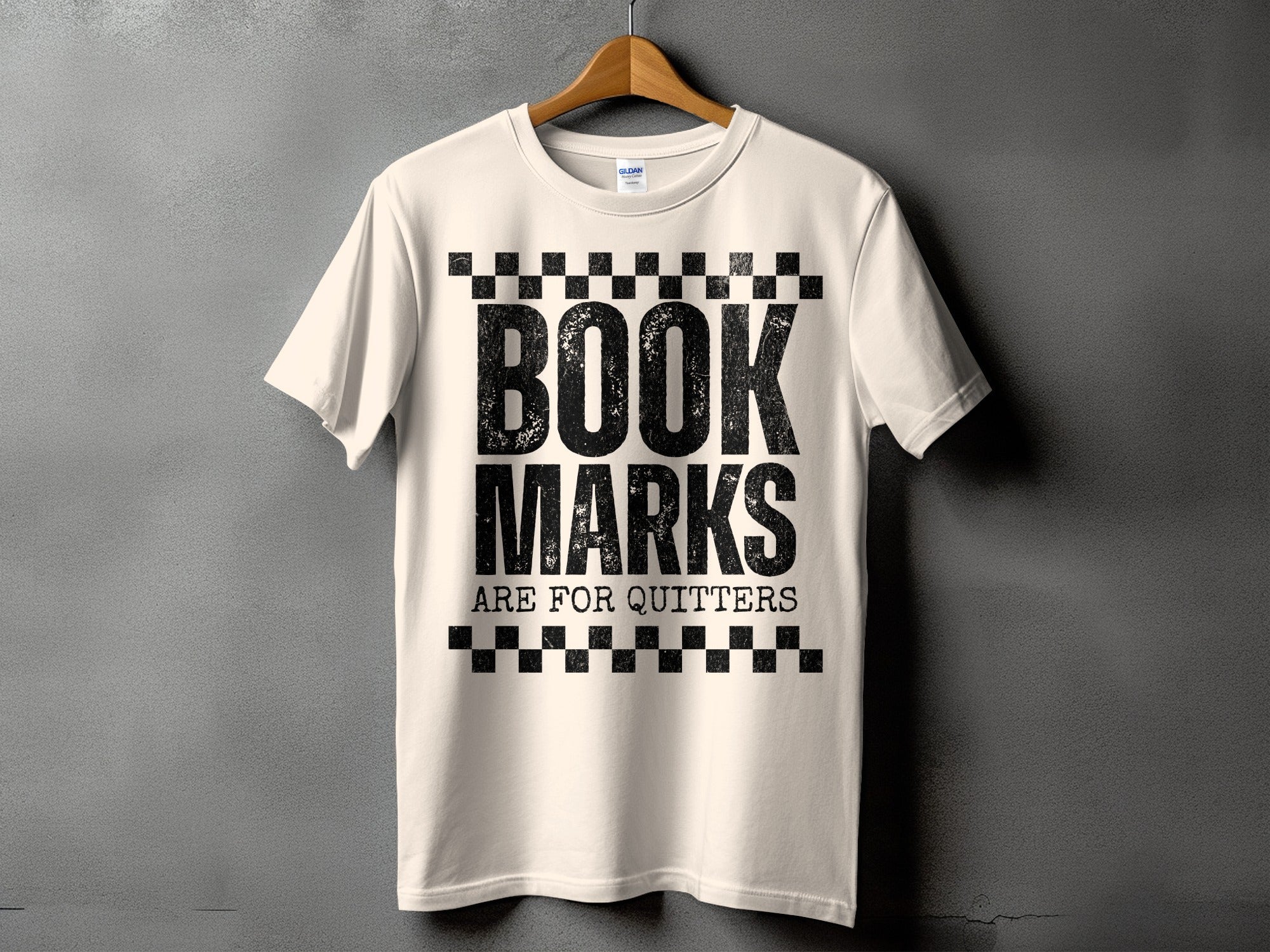 Cream t-shirt with black distressed text "BOOK MARKS ARE FOR QUITTERS".