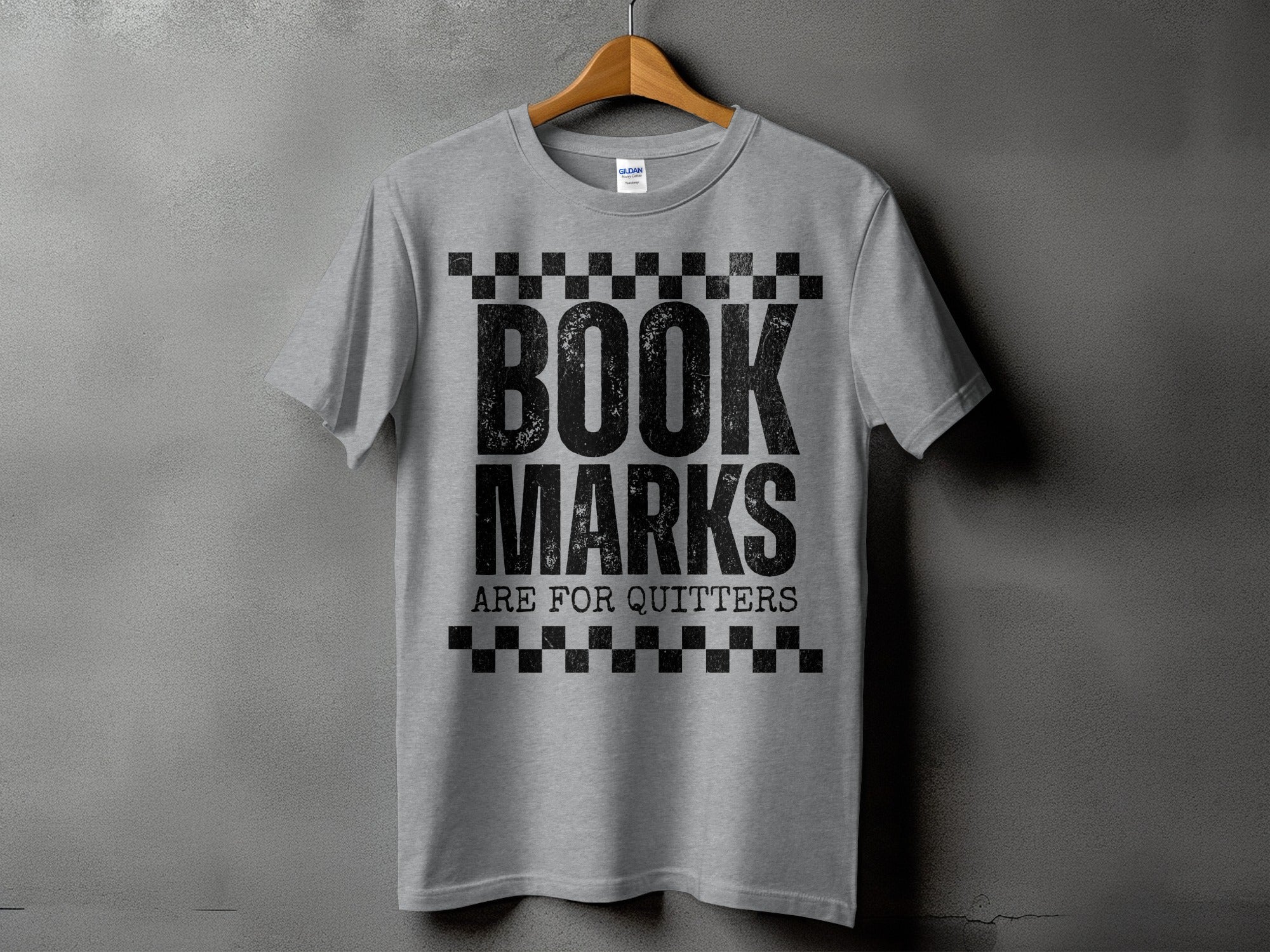 Grey t-shirt with distressed text "BOOK MARKS ARE FOR QUITTERS".