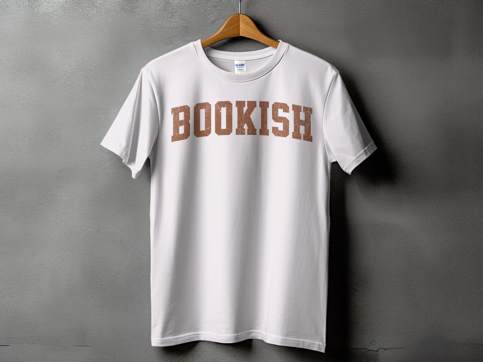 White t-shirt with brown distressed lettering that reads "BOOKISH".