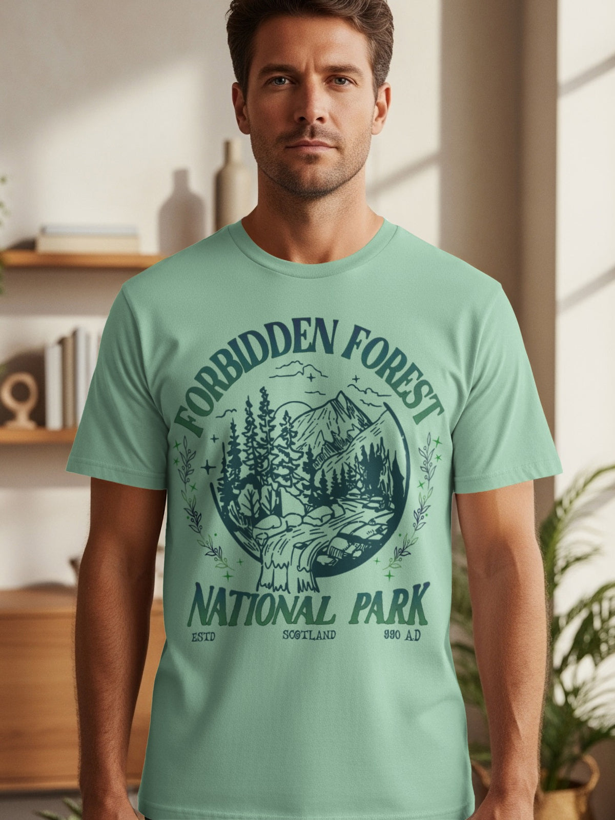 Mint green t-shirt with "Forbidden Forest National Park Scotland 990 AD" graphic.