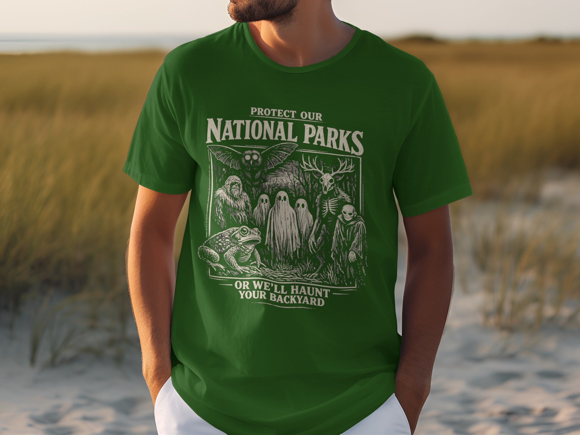 Green t-shirt with "Protect Our National Parks" and spooky creatures.