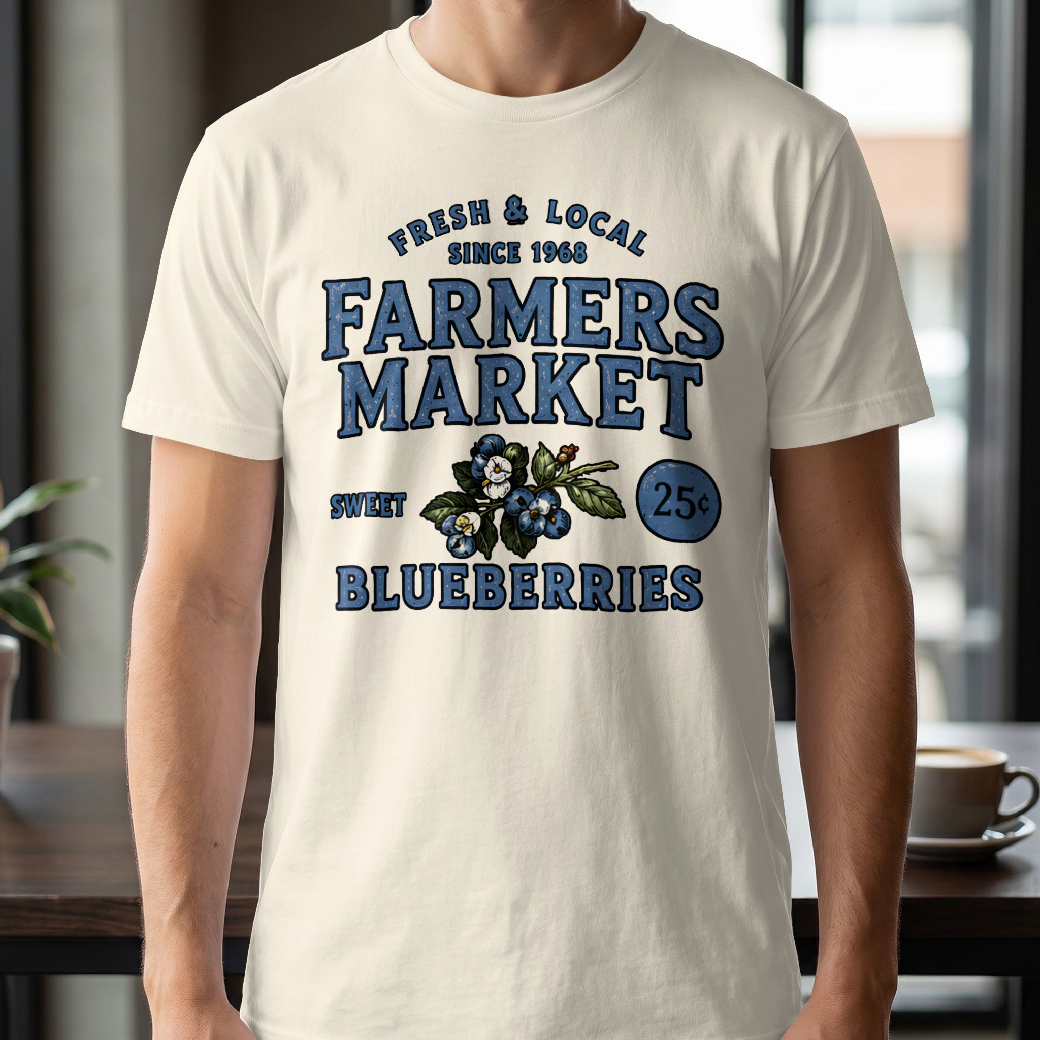 Cream t-shirt with "Farmers Market" text, blueberries, and "25¢" graphic.