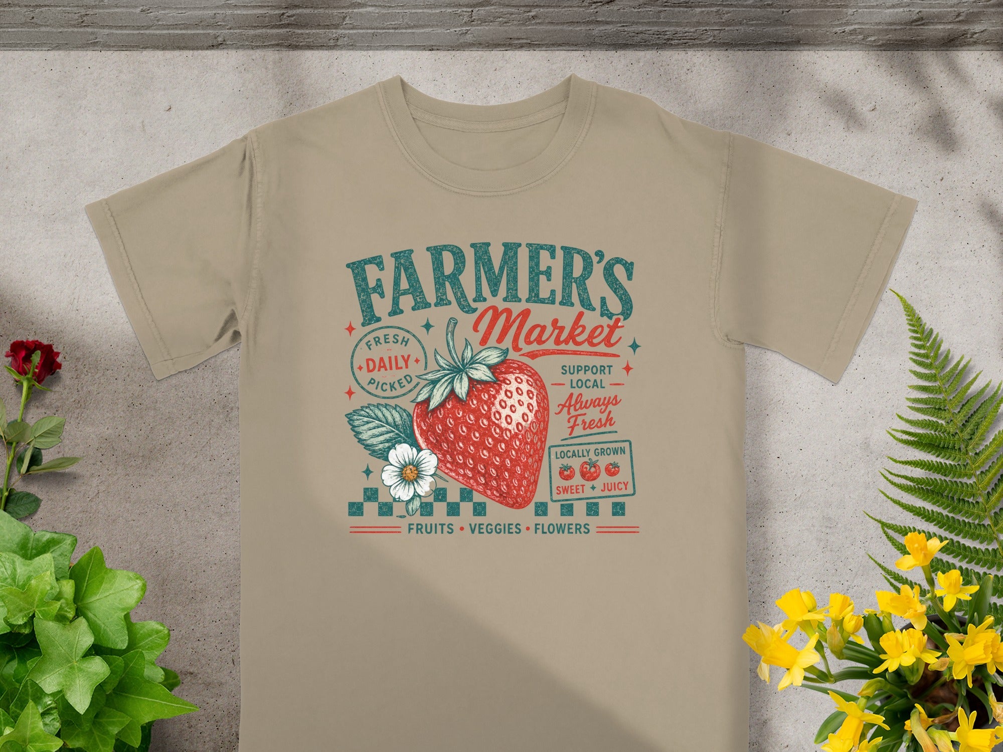 T-shirt with "Farmer's Market" design featuring strawberry, flower, and text.