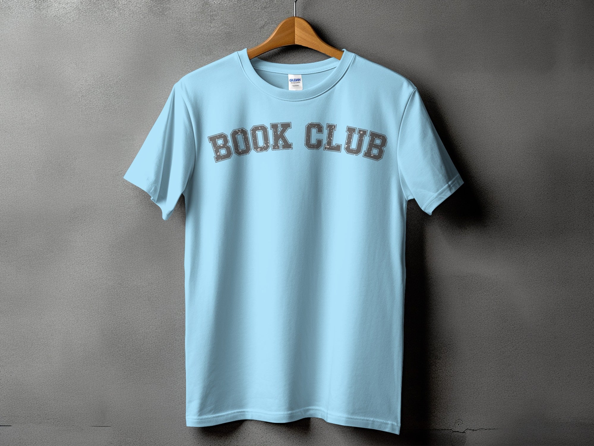 Light blue t-shirt with "BOOK CLUB" printed in distressed grey letters.