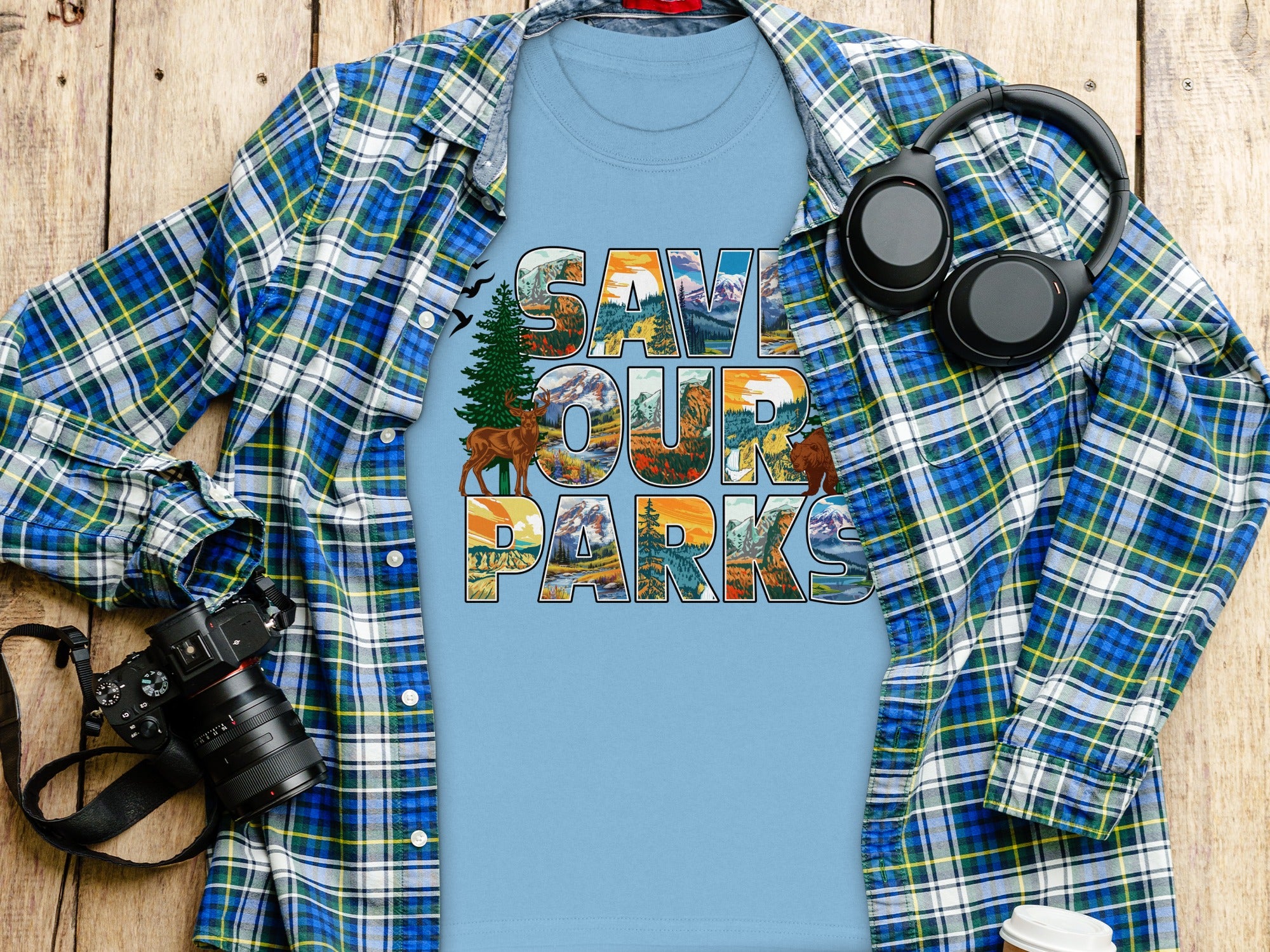 Light blue t-shirt with "Save Our Parks" graphic featuring mountains, forests, deer, and bear.