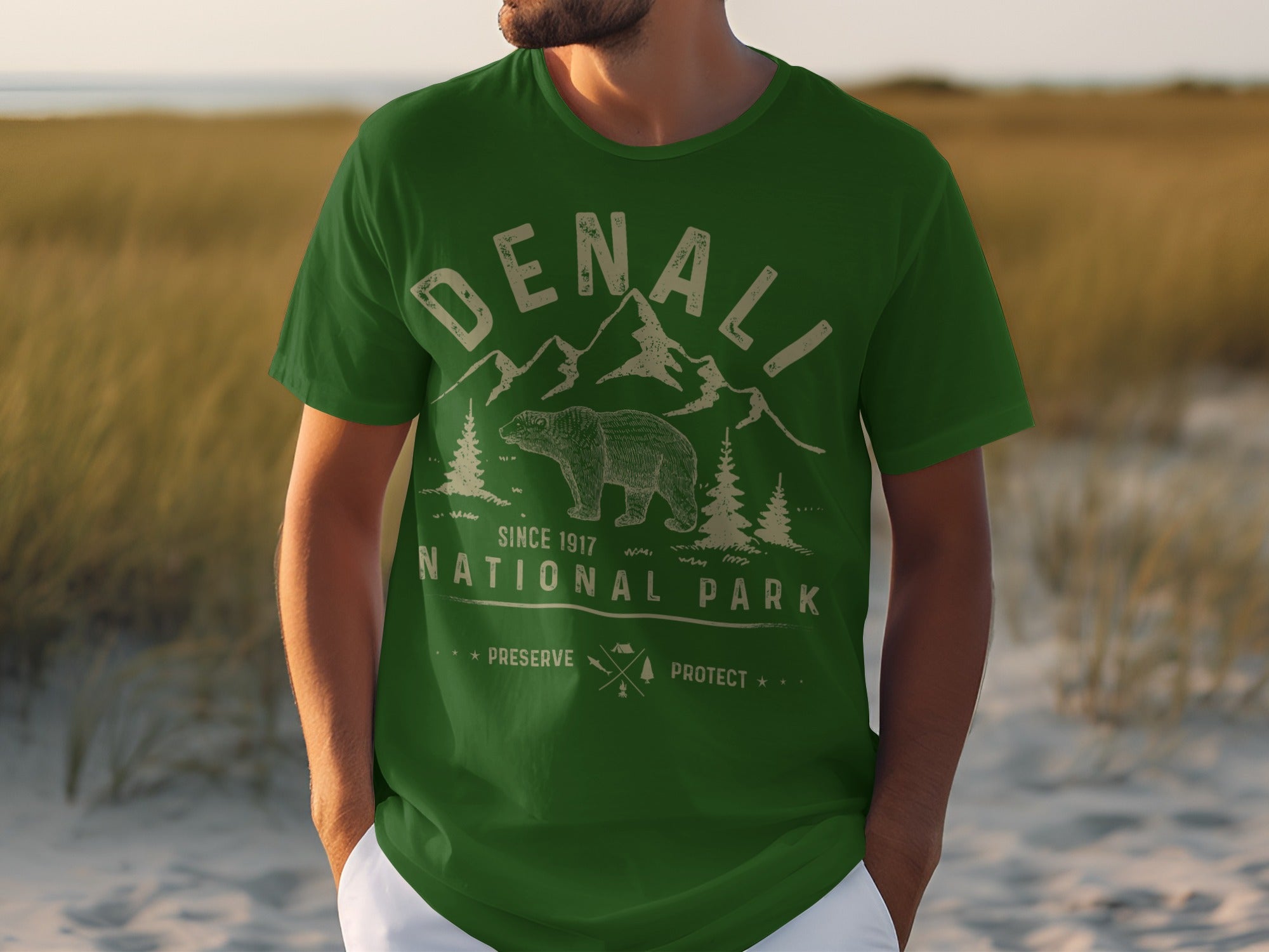 Green t-shirt with Denali National Park graphic featuring bear, mountains, and trees.