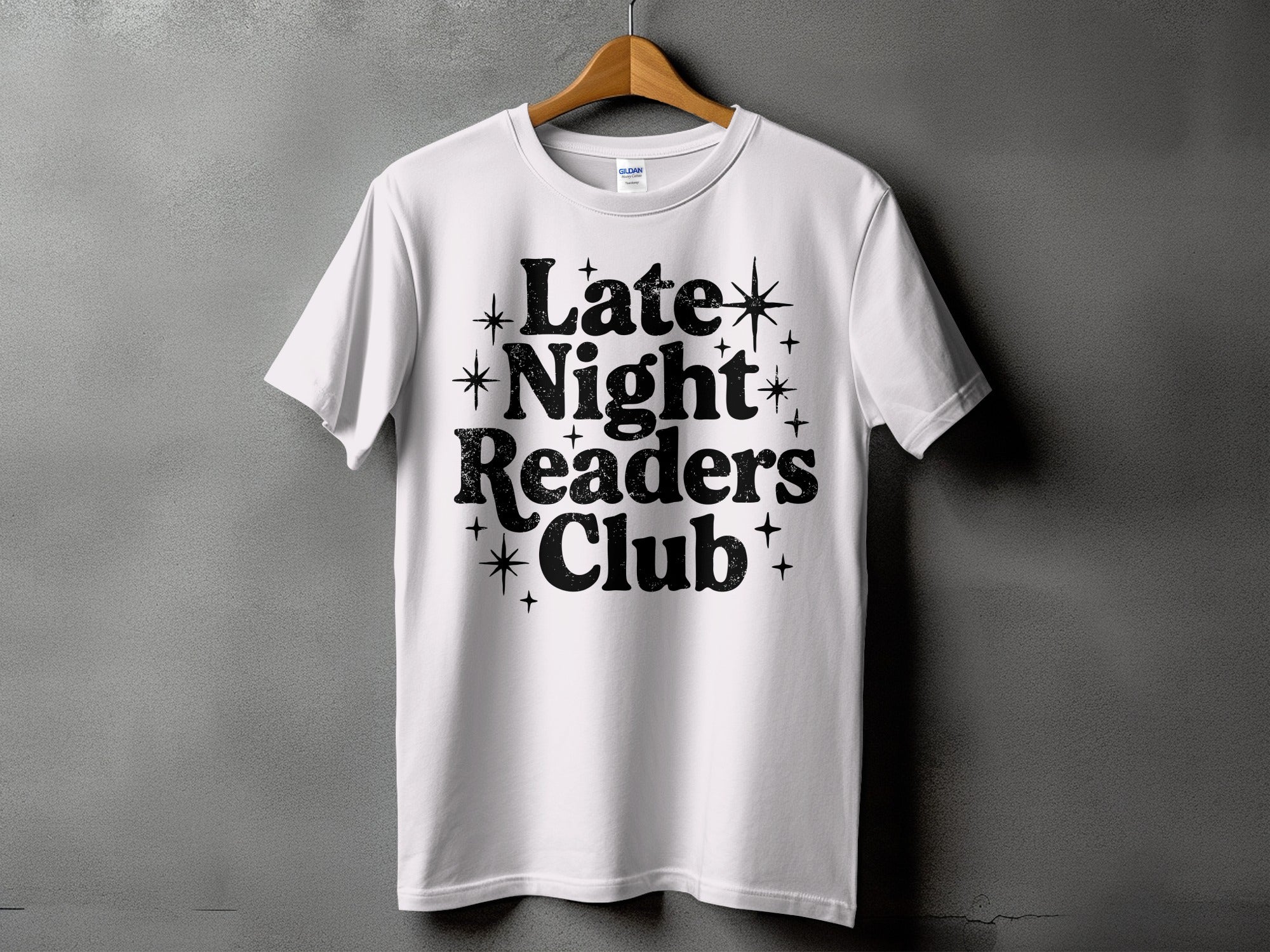 White t-shirt with black distressed text "Late Night Readers Club" and star accents.