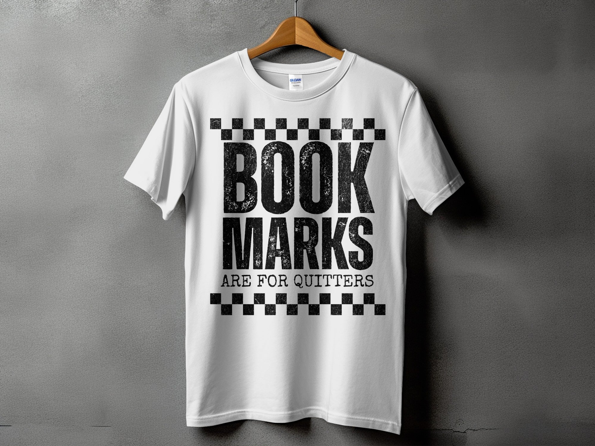 White t-shirt with black distressed text "BOOK MARKS ARE FOR QUITTERS".