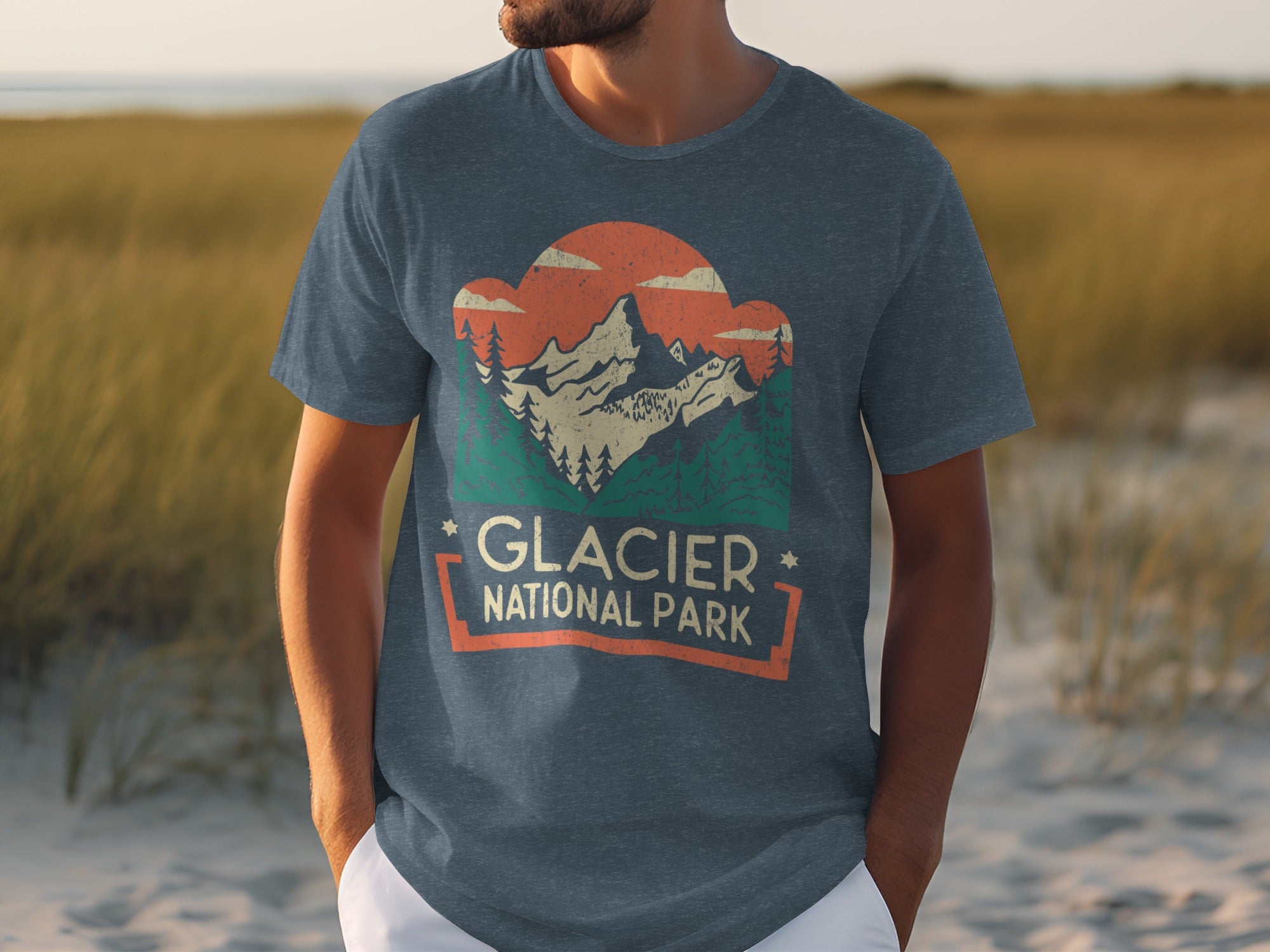 Glacier National Park graphic t-shirt with mountains, trees, and clouds.