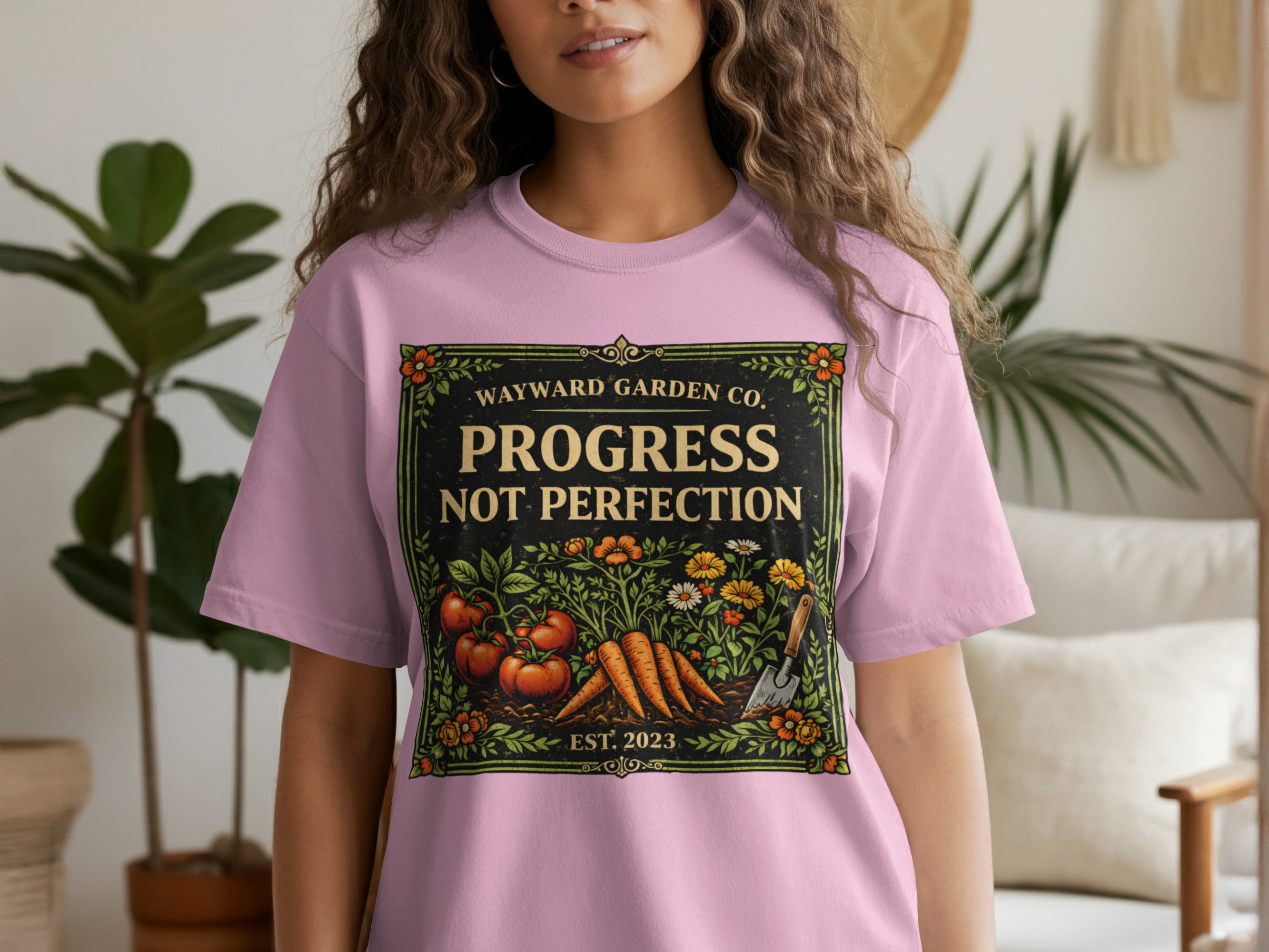 Pink t-shirt with "Progress Not Perfection" in a garden graphic.