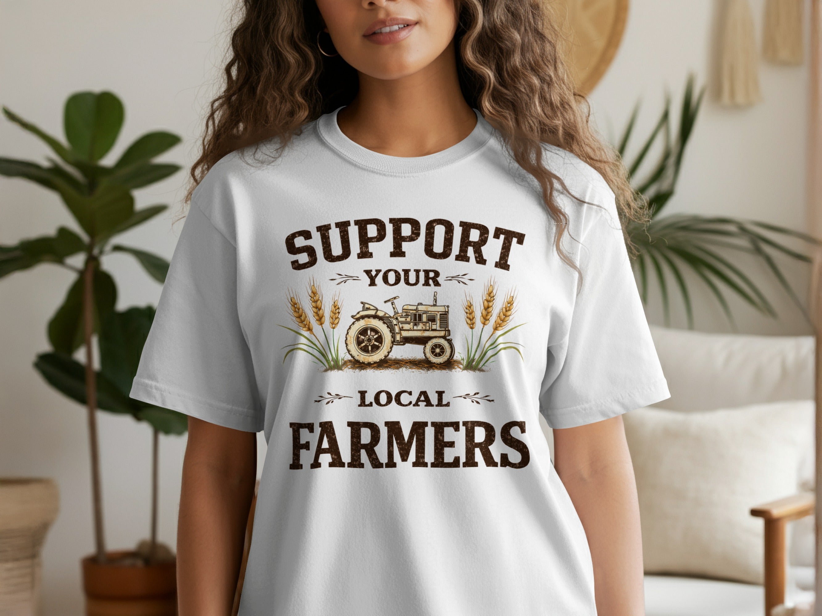 White t-shirt with text "Support Your Local Farmers" and a tractor illustration.