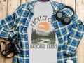 T-shirt with nature graphic and text "PROTECT OUR NATIONAL PARKS."