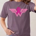 Pink ribbon superimposed on Wonder Woman-inspired wings logo.