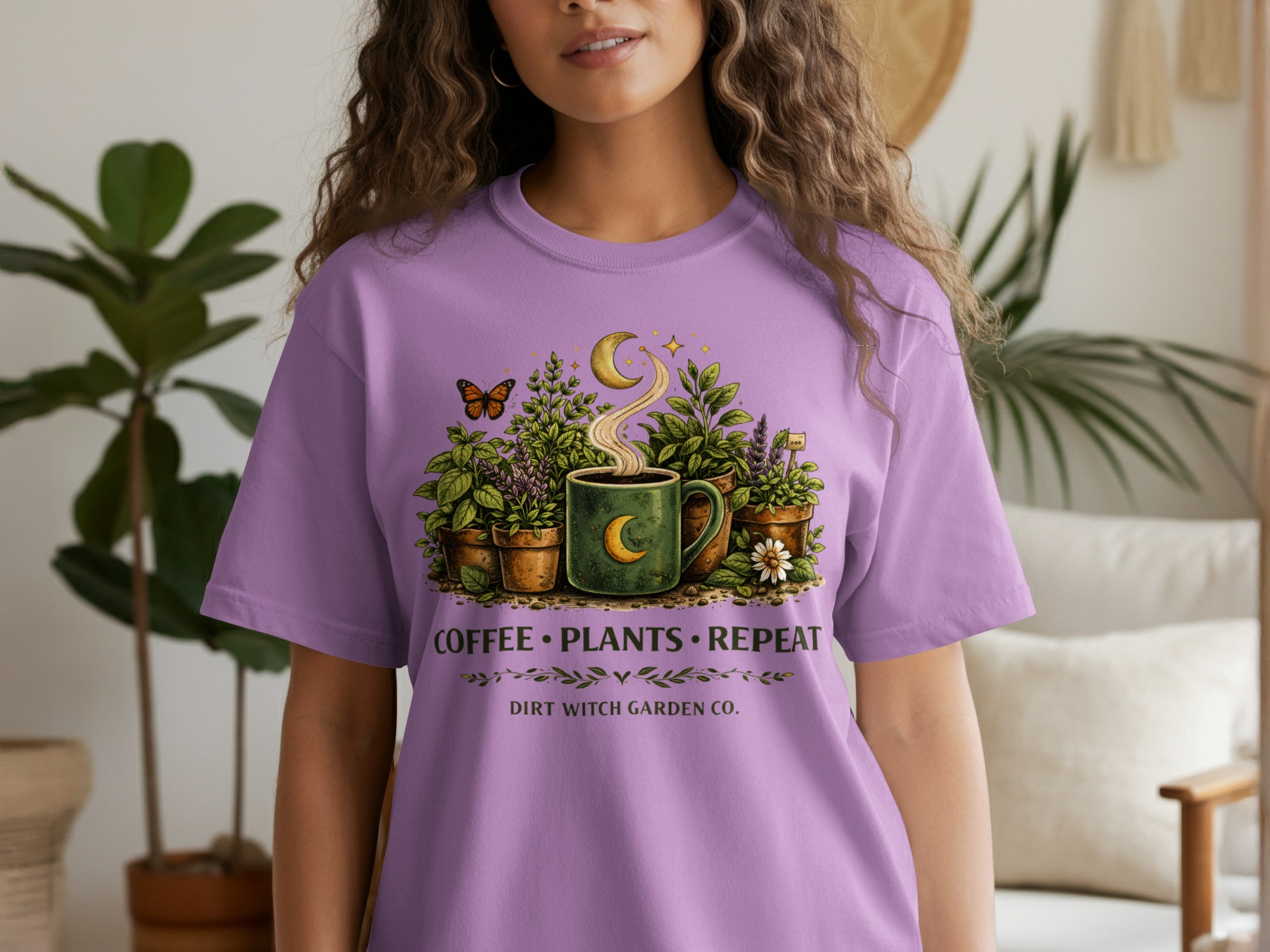 Purple t-shirt with a cosmic coffee and plant design, reading "Coffee Plants Repeat Dirt Witch Garden Co."