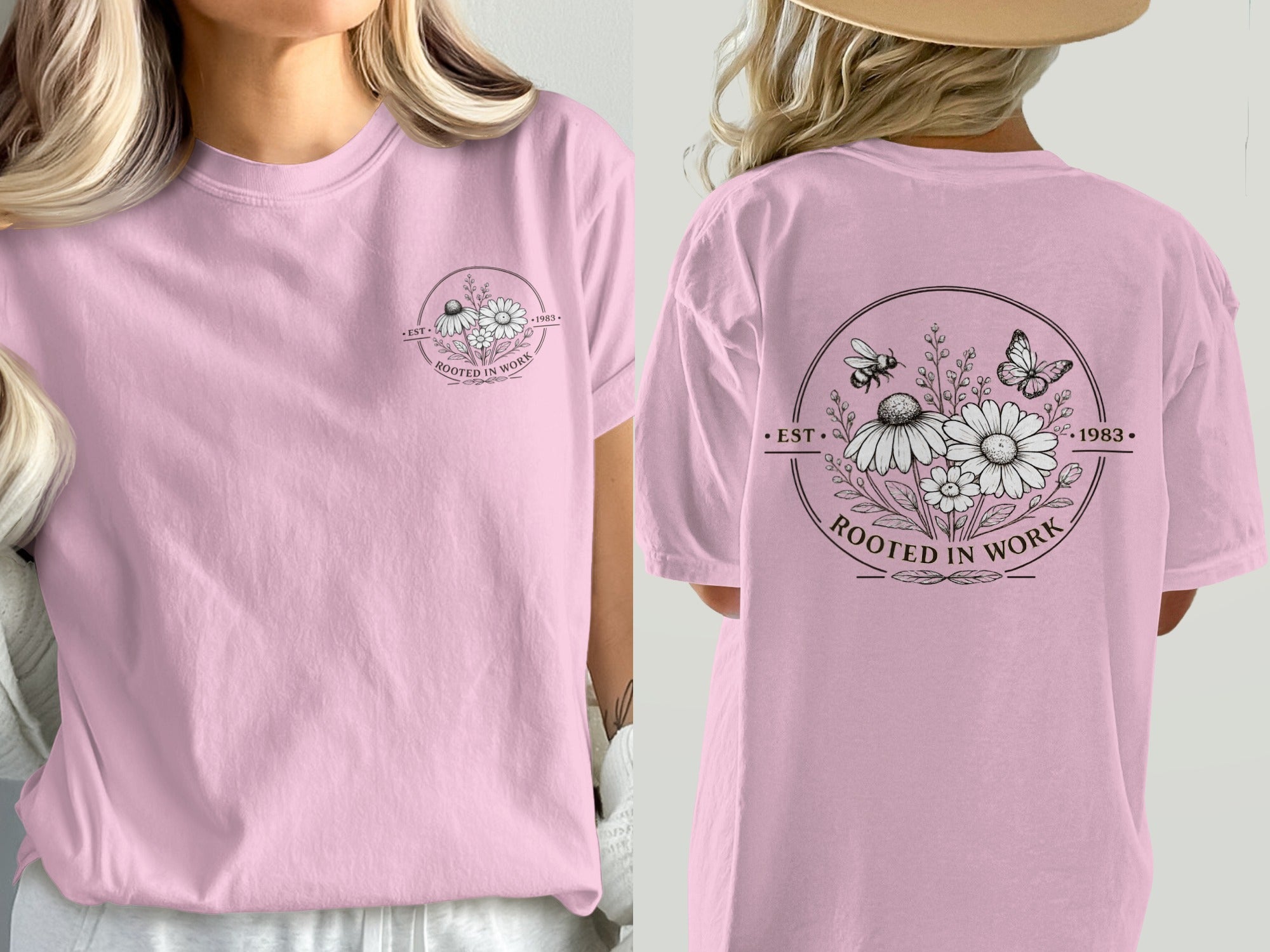 Pink t-shirt with floral design and text "Rooted in Work 1983" on back.
