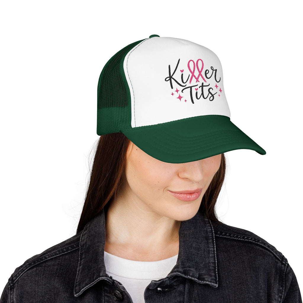 Green and white trucker hat with pink ribbon and "Killer Tits" text.