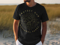 Black t-shirt with "Protect Our National Parks" text and sunburst nature graphic.